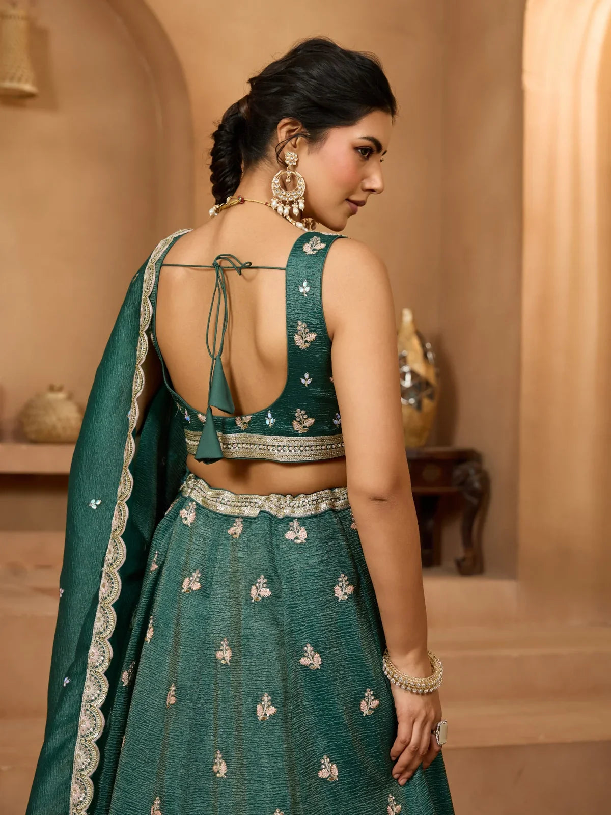 Tarani designer green tissue lehenga back view with tie-up blouse and dupatta