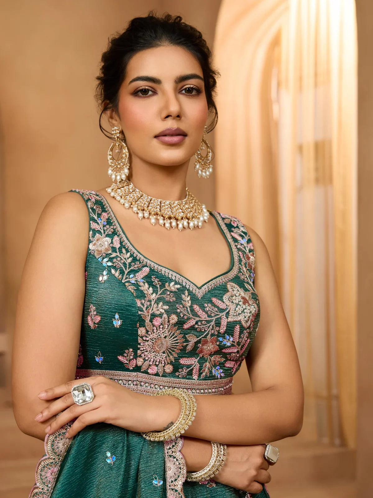 Tarani elegant green tissue lehenga upper body view with embroidered blouse and jewellery