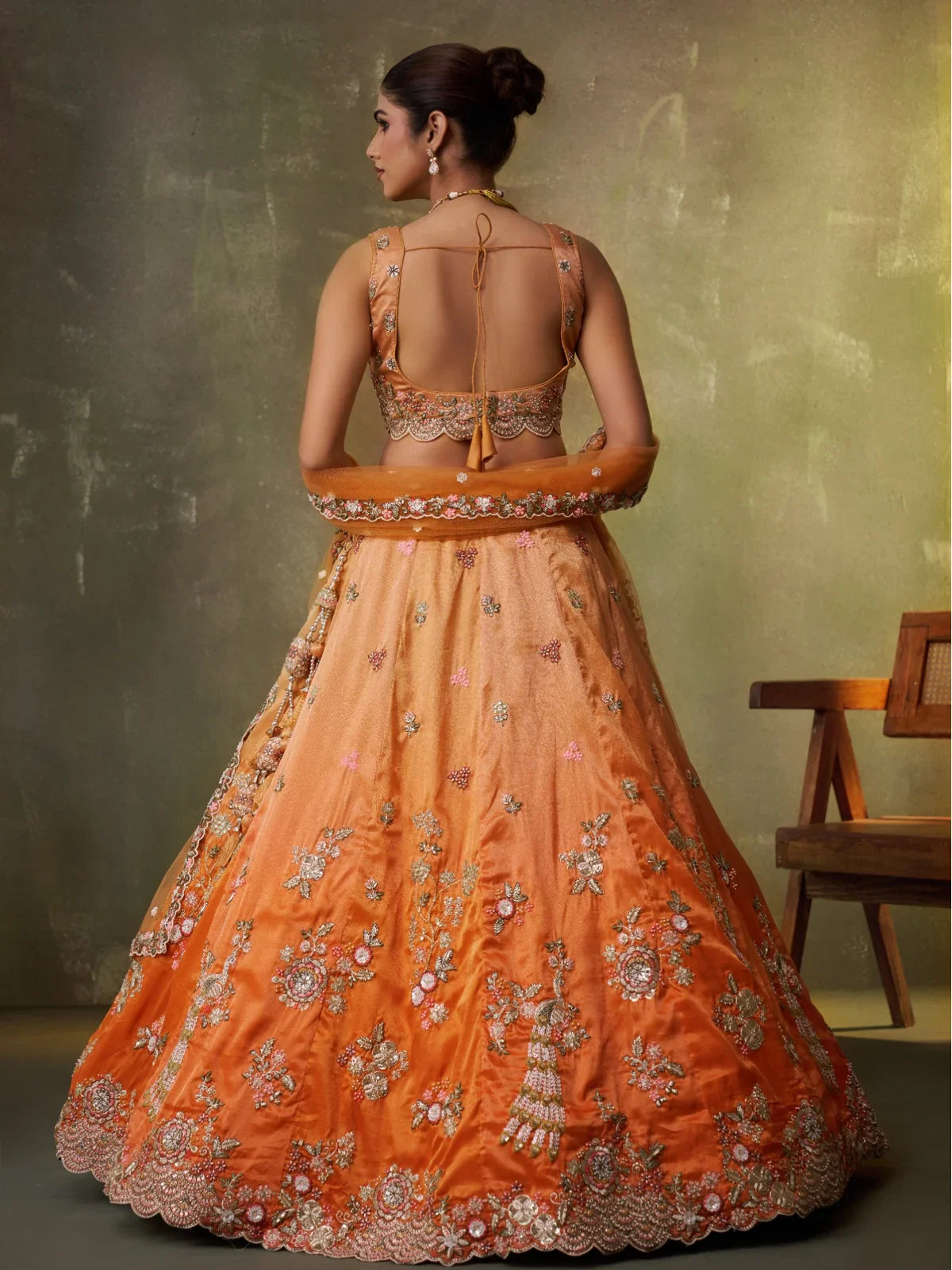 Tarani back pose showing blouse design and full lehenga back view