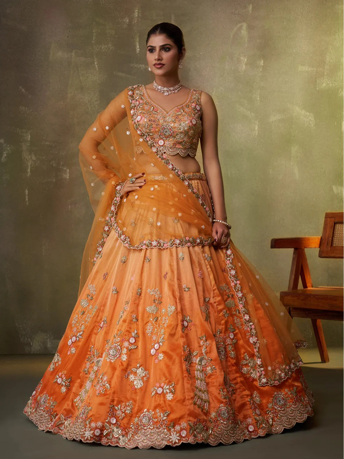 Tarani designer tissue orange lehenga with embroidery and dupatta perfect for weddings