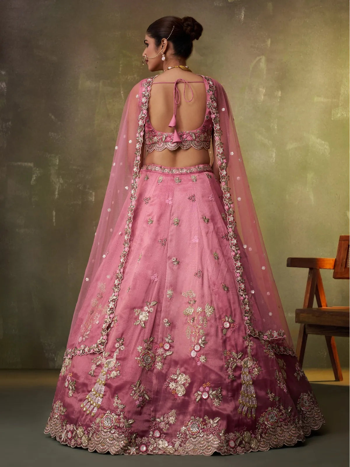 Tarani back view of tissue lehenga with open-back blouse and embroidered dupatta