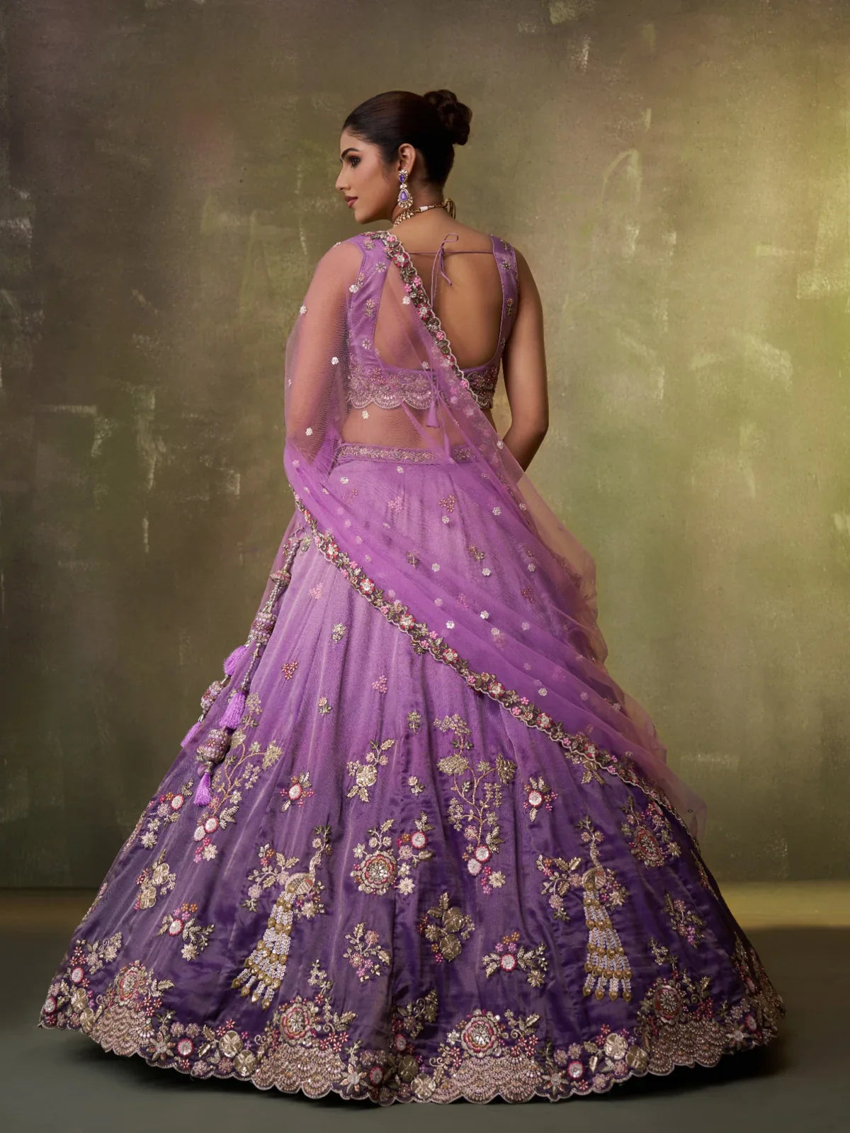 Tarani tissue lehenga back view with open-back blouse and embroidered dupatta