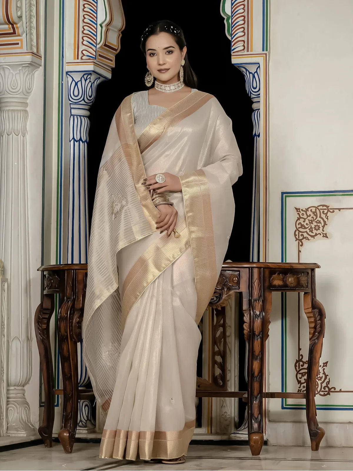 Tarani off white tissue linen saree with zari patta and khatli work blouse full view