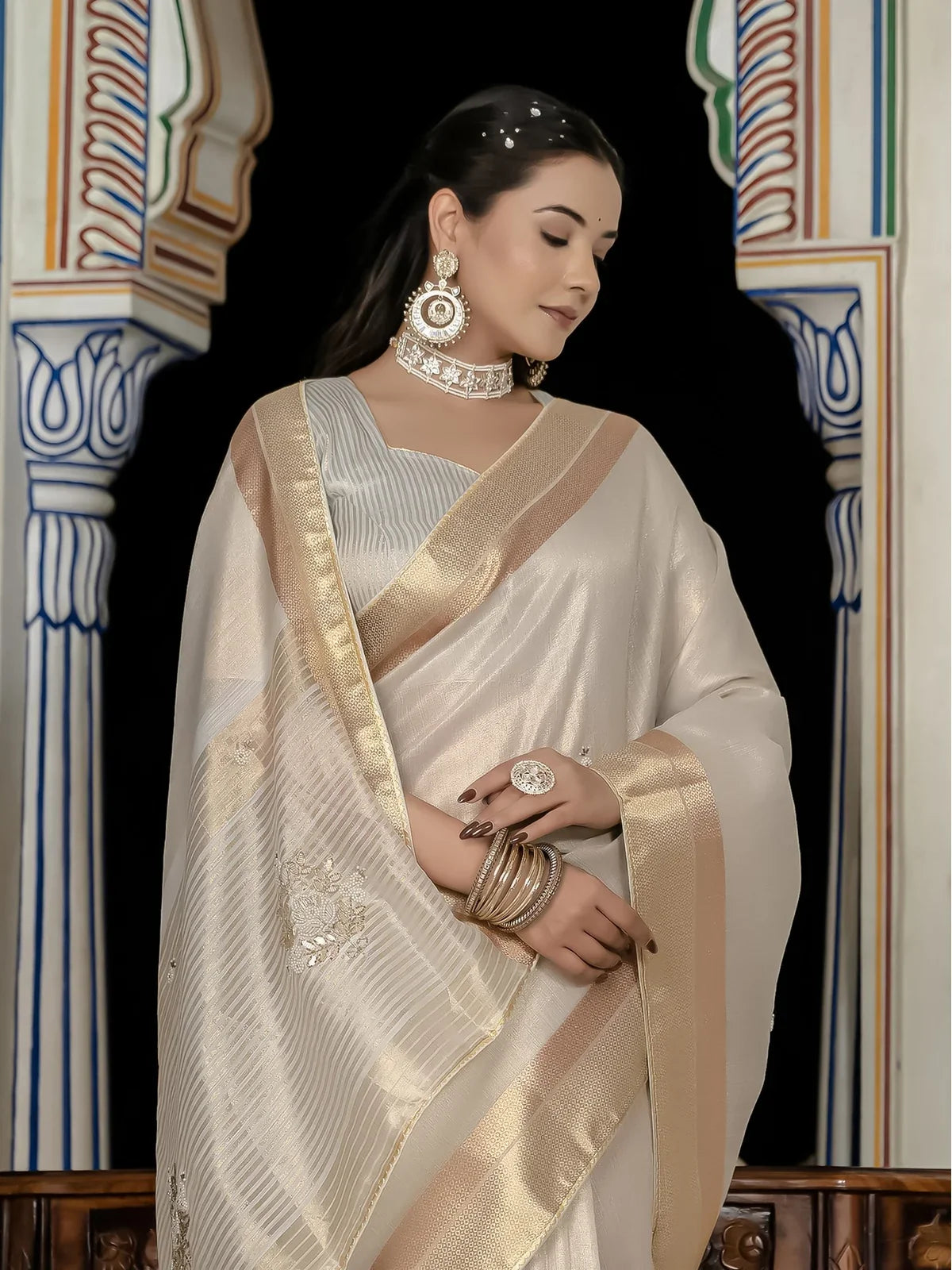 Tarani off white tissue linen saree with zari patta closeup upper body view