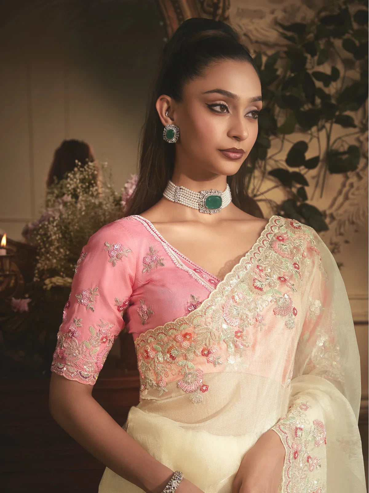 Tarani elegant off white tissue organza saree upper body view with embroidered pink blouse and border