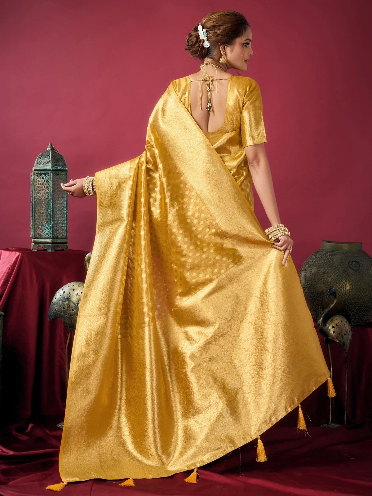 Tarani Rashmika golden Tissue Silk saree back view with stylish blouse design and elegant drape