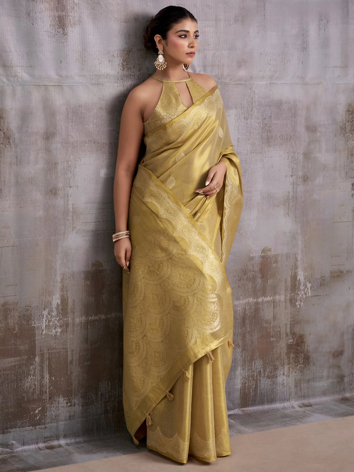Tarani golden tissue silk saree with woven border front view for party festive and wedding wear