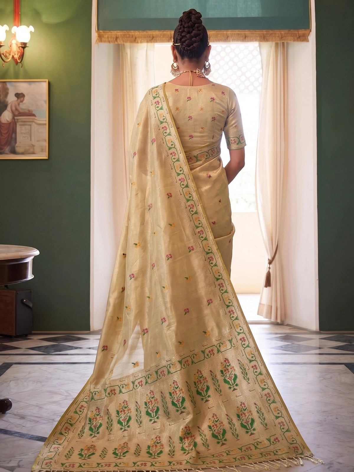 Tarani Swarali golden tissue silk saree pallu view with floral weaving and tassel finish