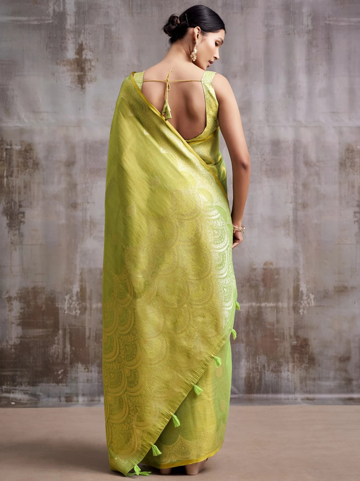 Tarani green tissue silk saree back view with pallu and blouse design