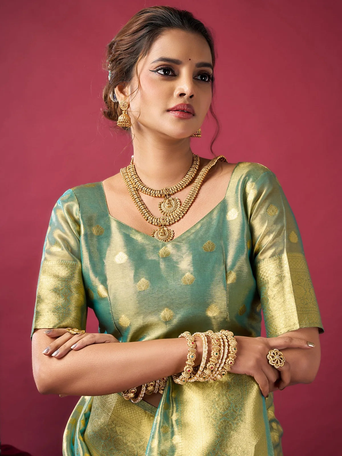 Tarani Dakshina green tissue silk saree upper body view with woven blouse and zari detailing