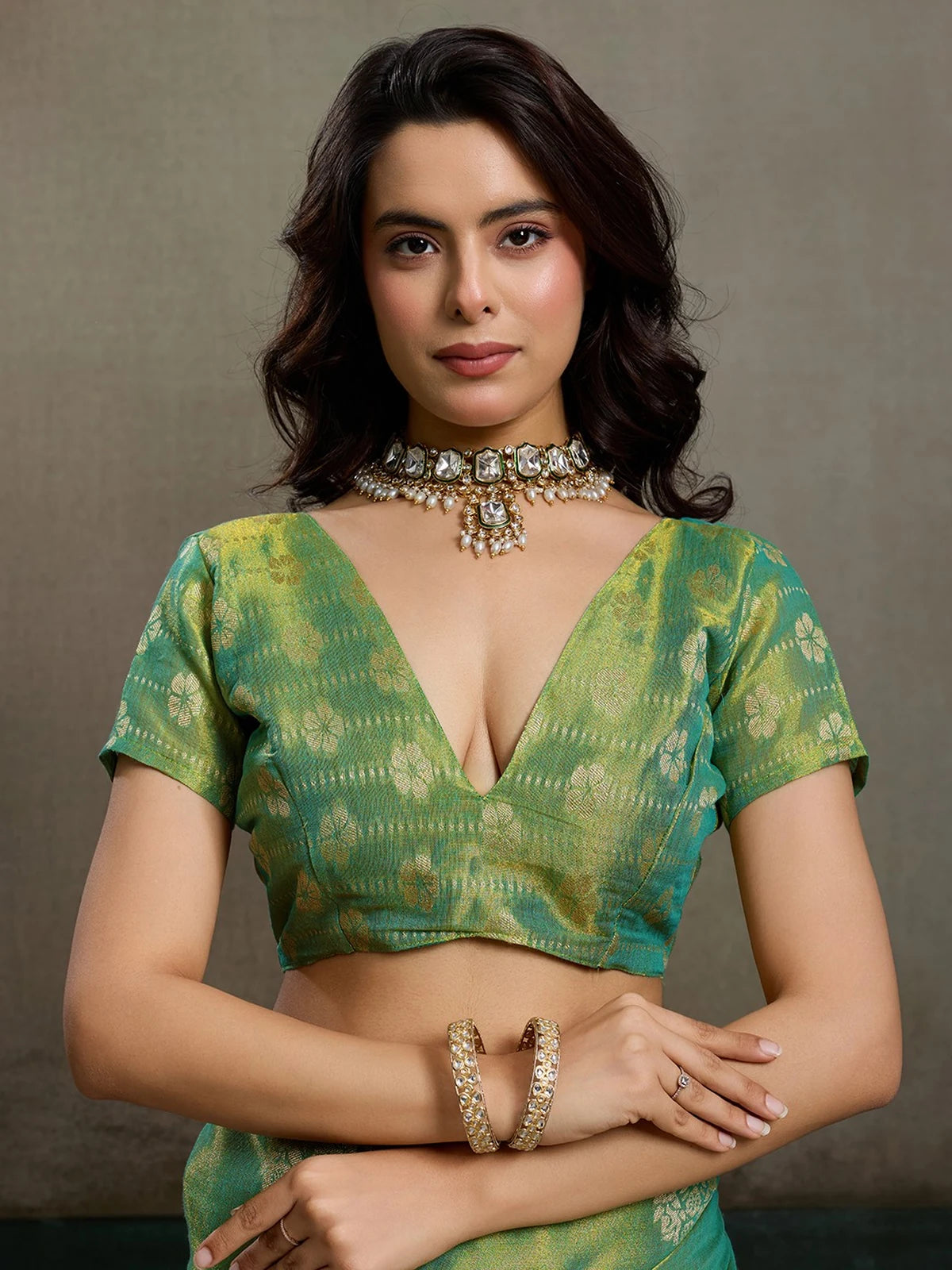 Tarani green tissue silk saree blouse upper body view with woven zari detailing