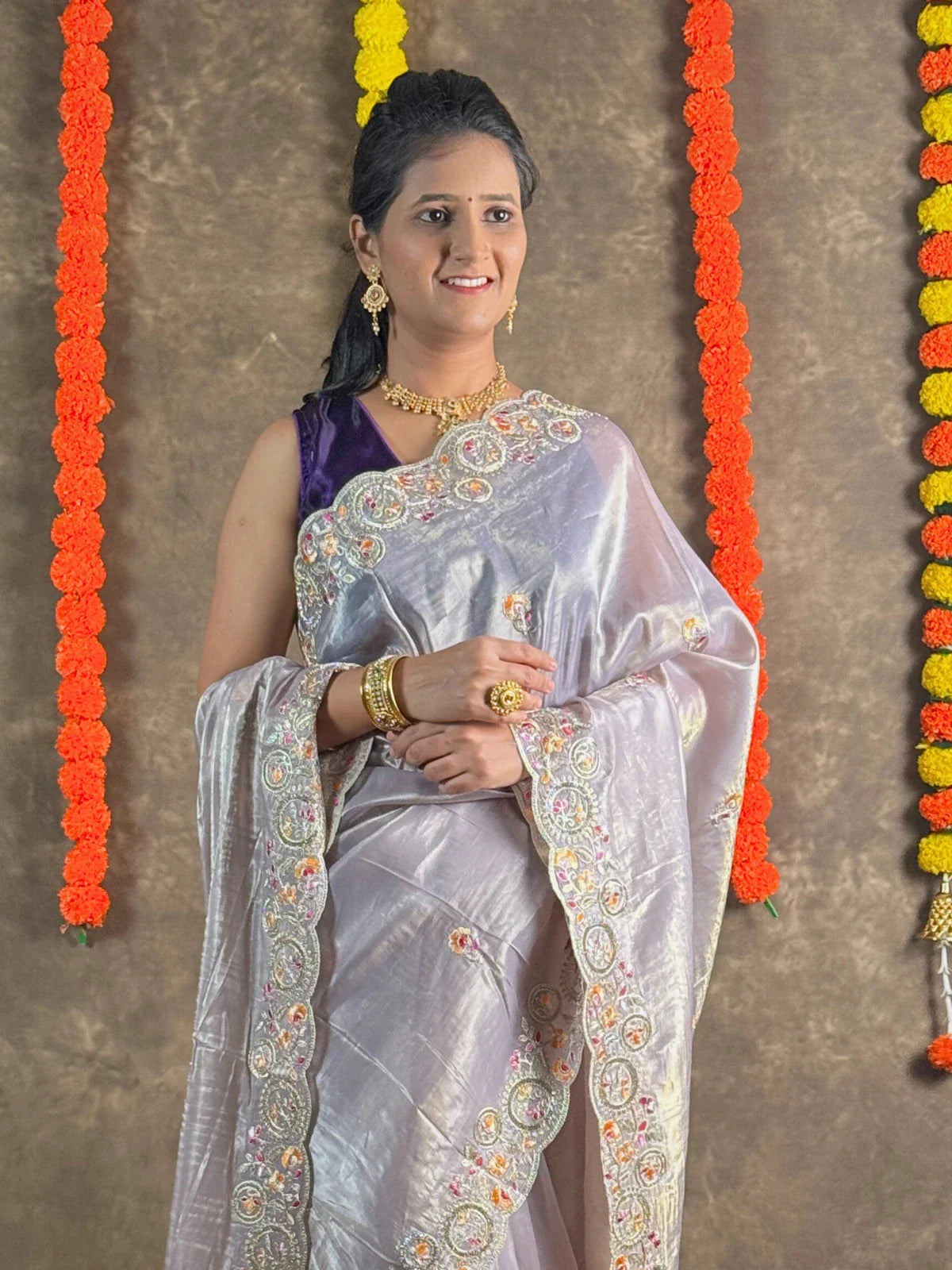 Tarani lavender tissue silk saree upper body view with intricate embroidery and jewellery styling