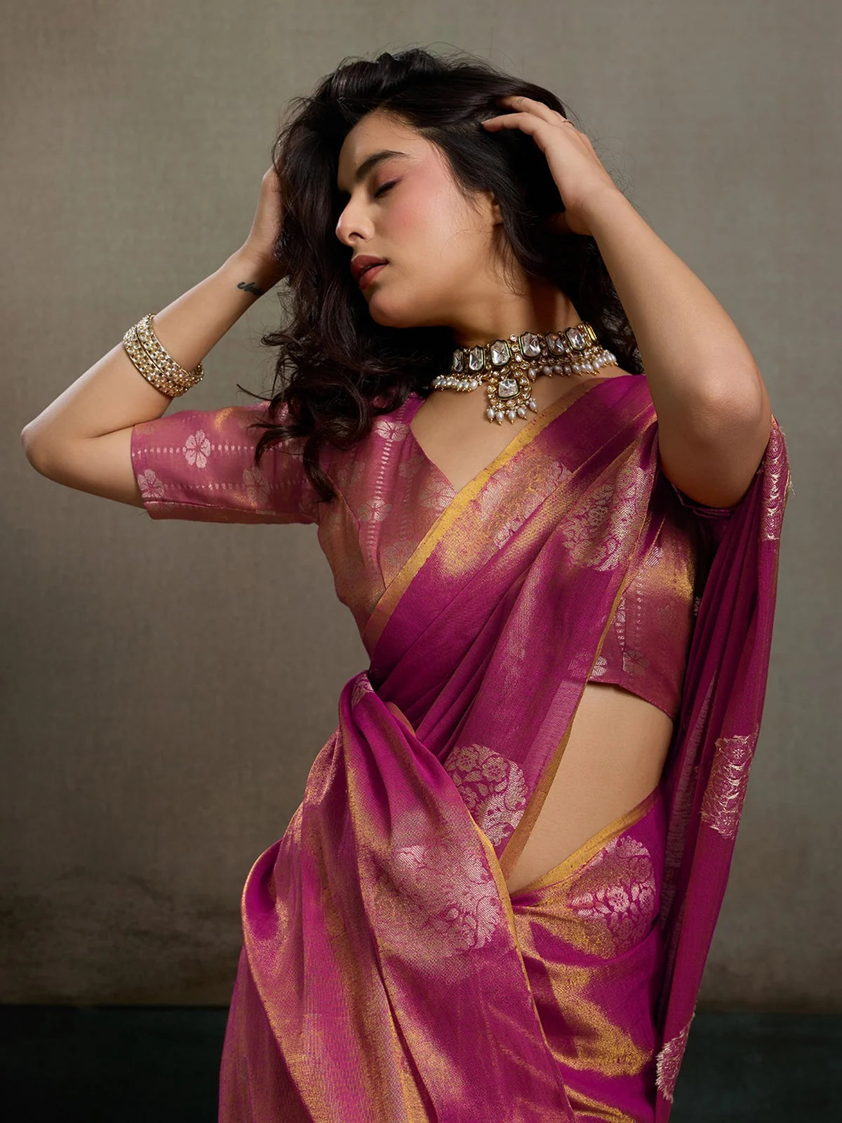 Tarani magenta tissue silk saree closeup view showing rich zari texture and blouse design
