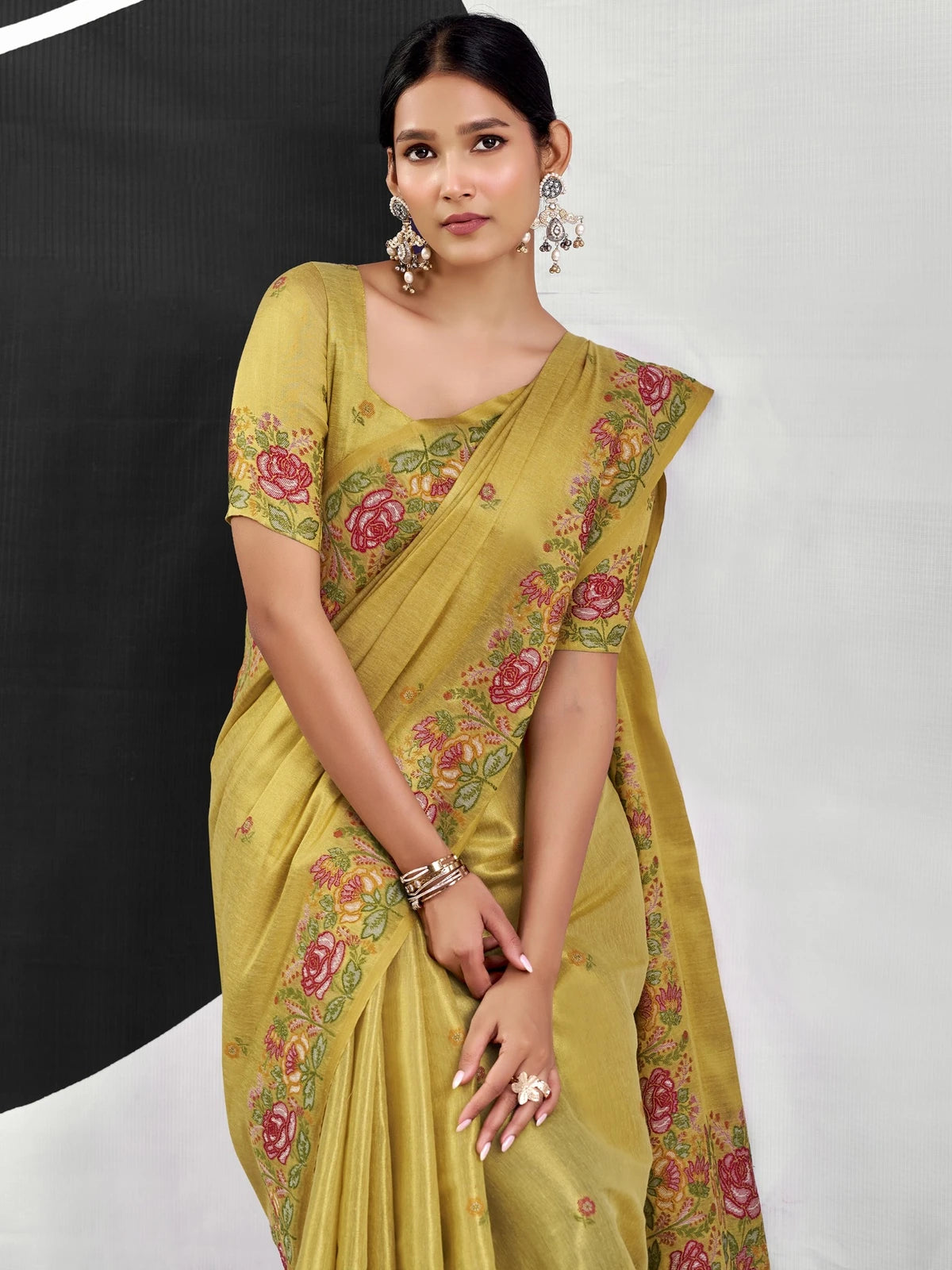 Tarani mustard tissue silk saree upper body view showing floral border and blouse design