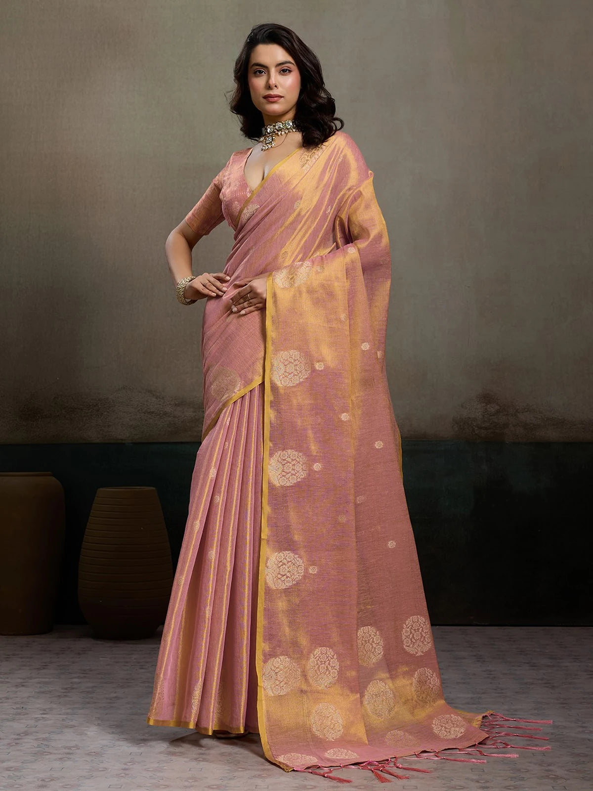 Tarani Indrayani pink tissue silk saree full view with golden woven motifs and tassel pallu for festive and wedding wear