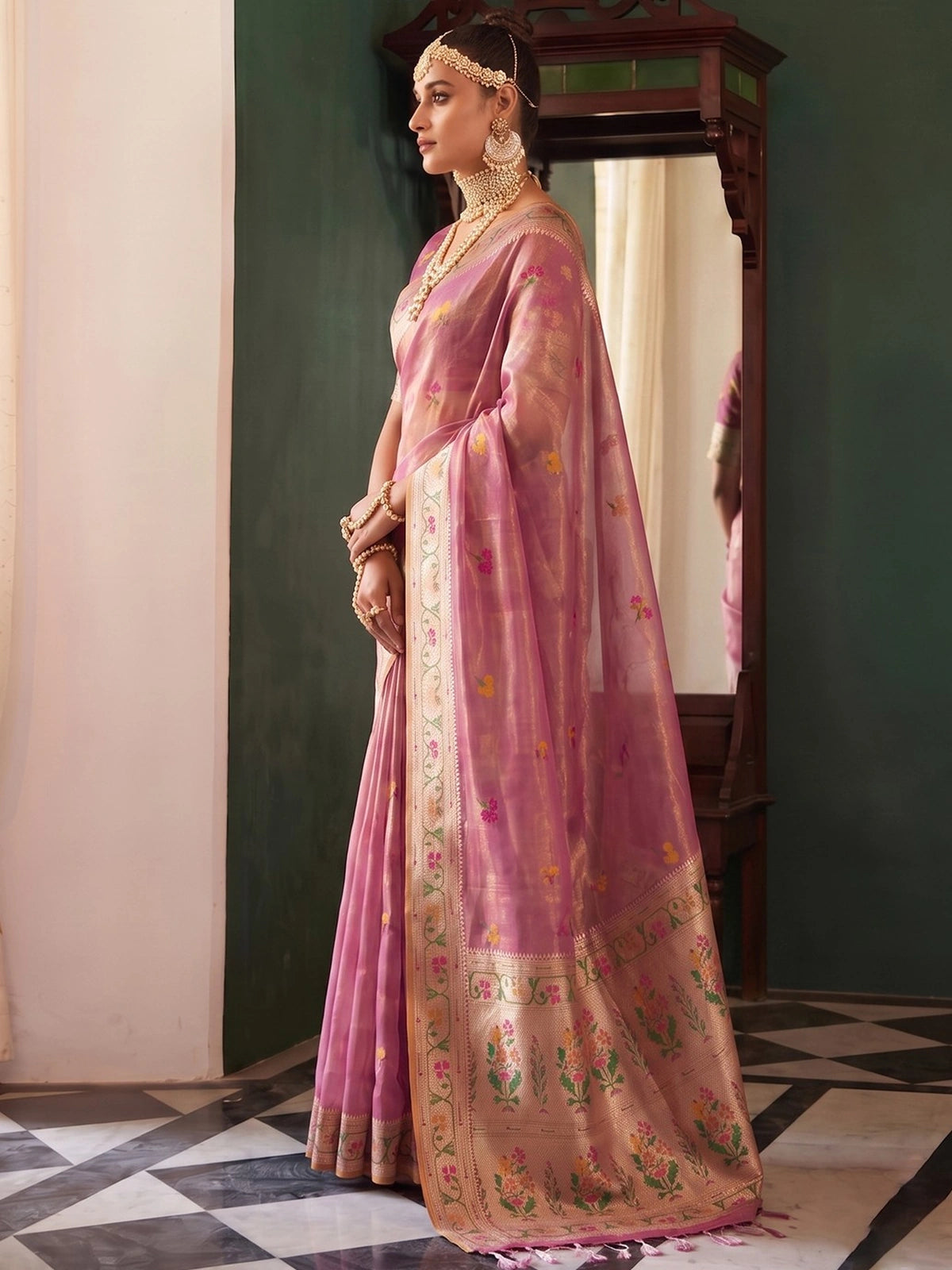 Tarani Mahati pink tissue silk saree with woven border and pallu in side view