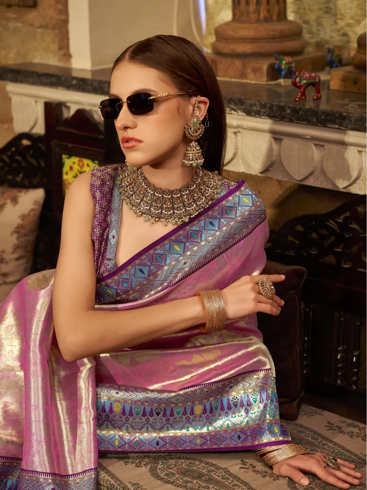 Tarani pink tissue silk saree upper body view styled with contrast blouse and jewellery