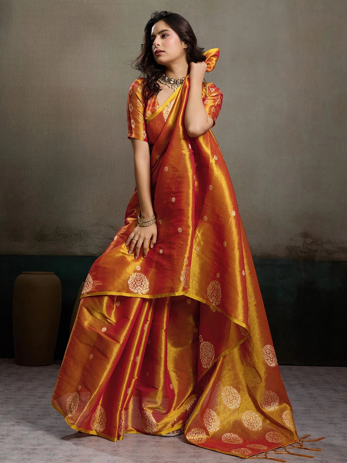 Tarani Baharika red tissue silk saree front view with rich sheen and festive elegance