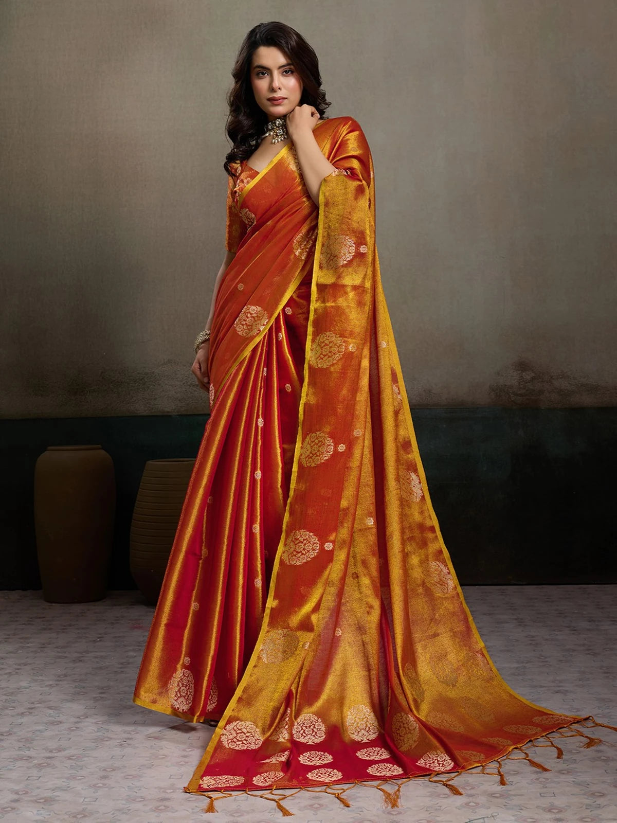 Tarani Baharika red tissue silk saree full view with zari motifs and elegant festive drape