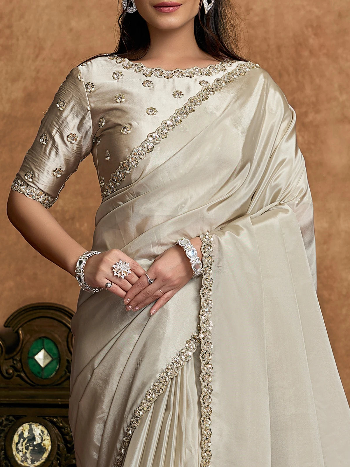 Tarani Surangi off white Uppada Silk saree front view featuring sequin embroidery and pearl border