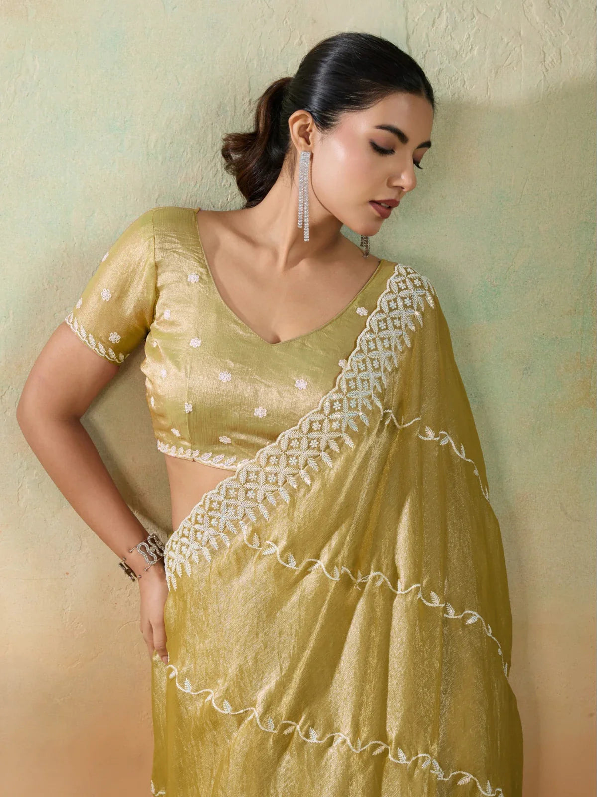 Tarani golden velvet chiffon saree upper body view showing blouse embroidery and rich fabric texture