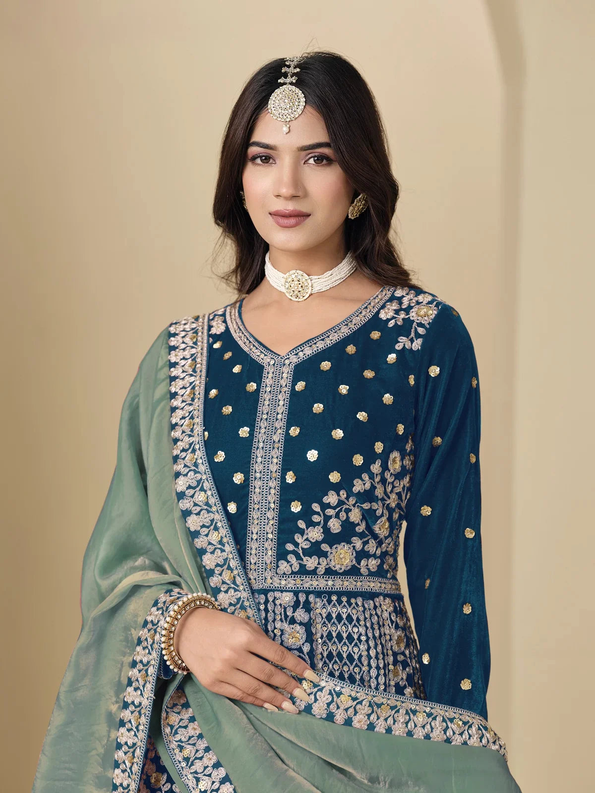 Tarani blue velvet dress upper body view showing neckline and sleeve embroidery