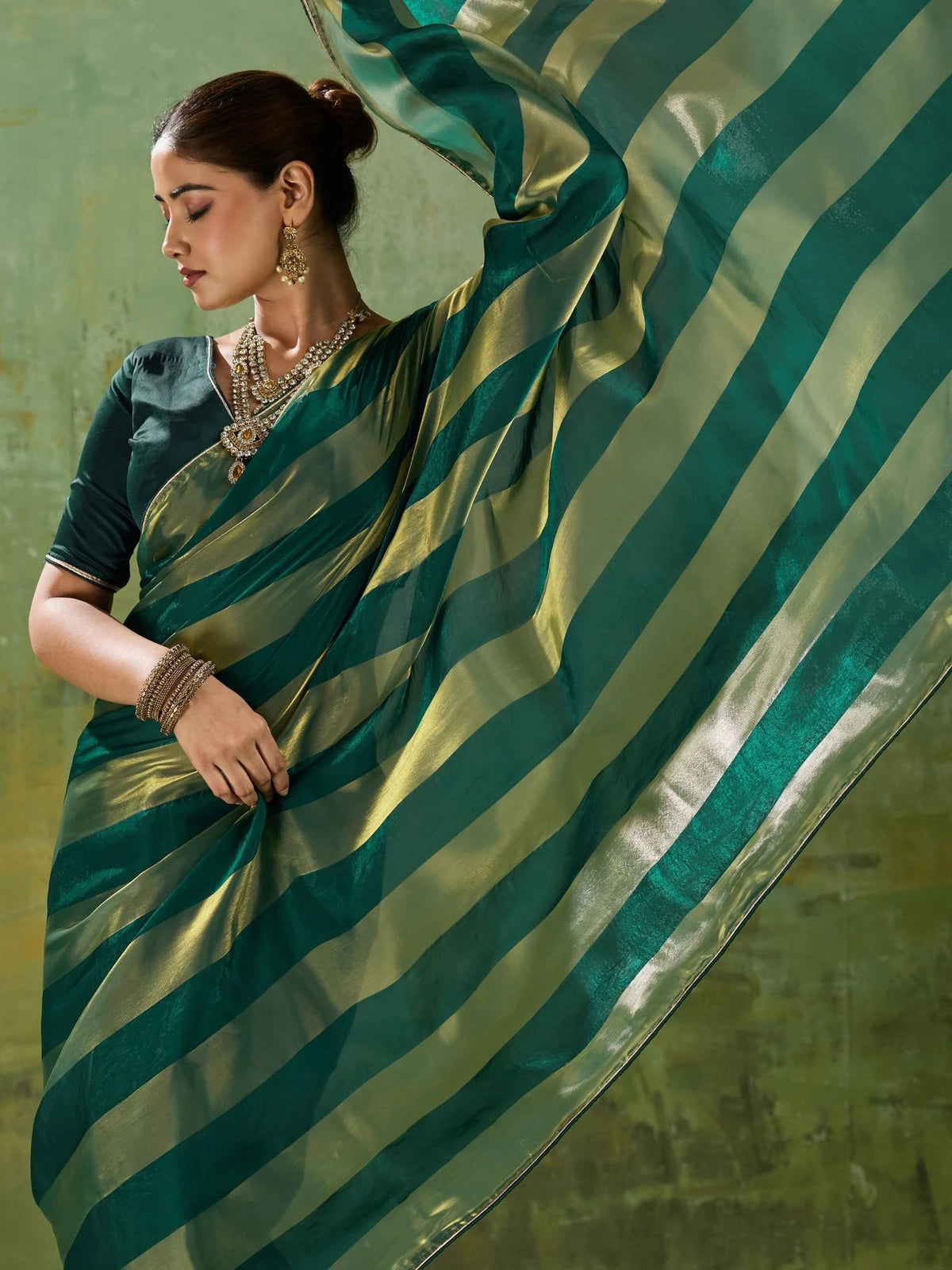 Tarani green velvet satin saree pallu view with metallic gold stripe detailing