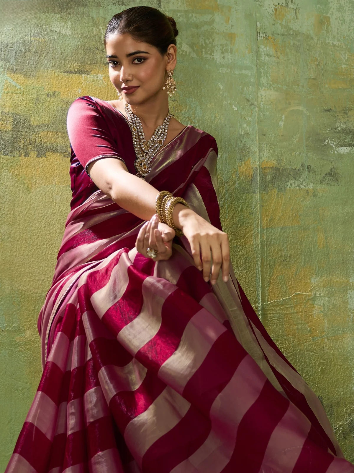 Tarani maroon velvet satin saree front pose with festive styling
