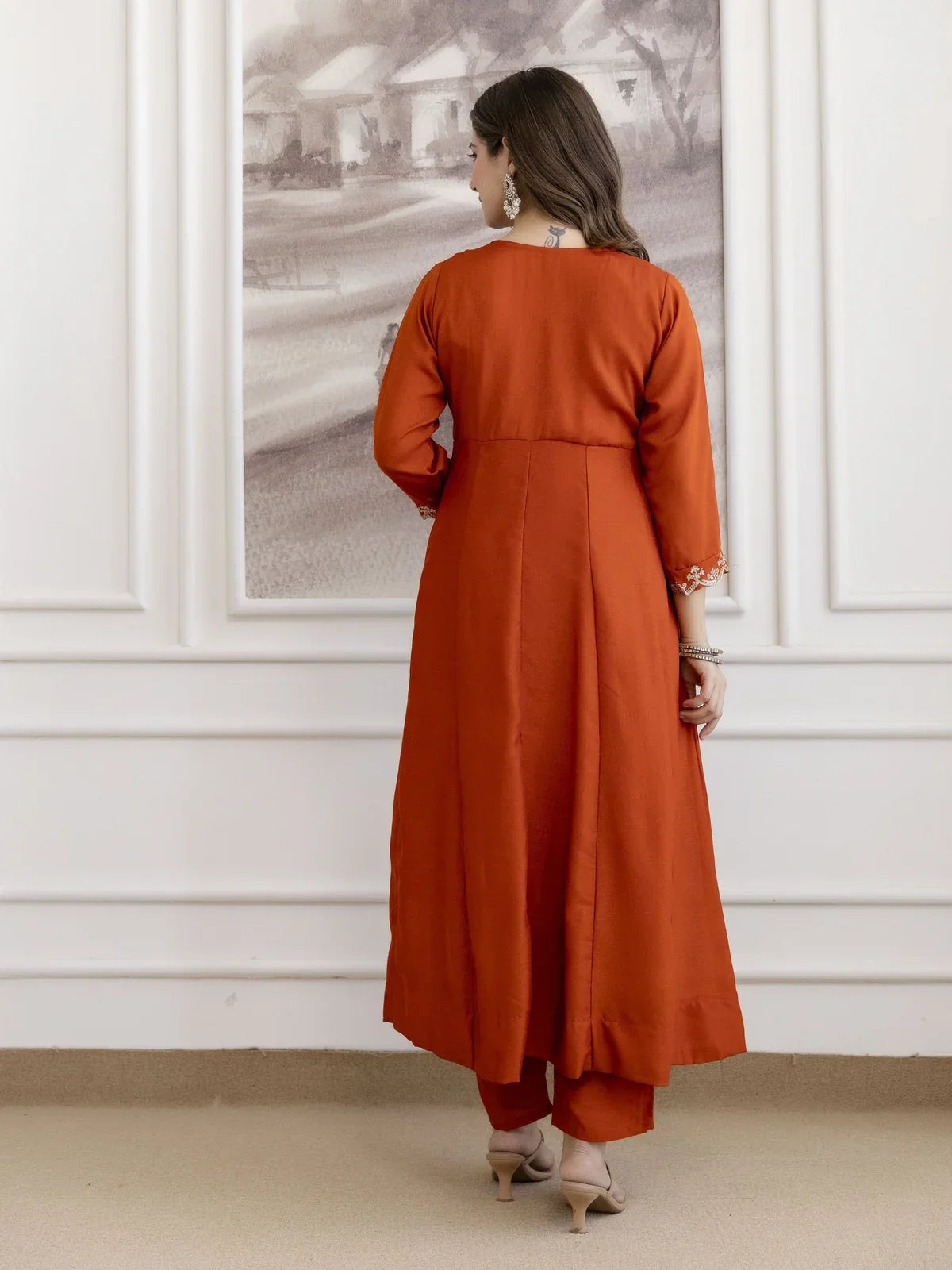 Tarani vichitra silk orange kurti dress back side pose with plain finish and clean tailoring in back view