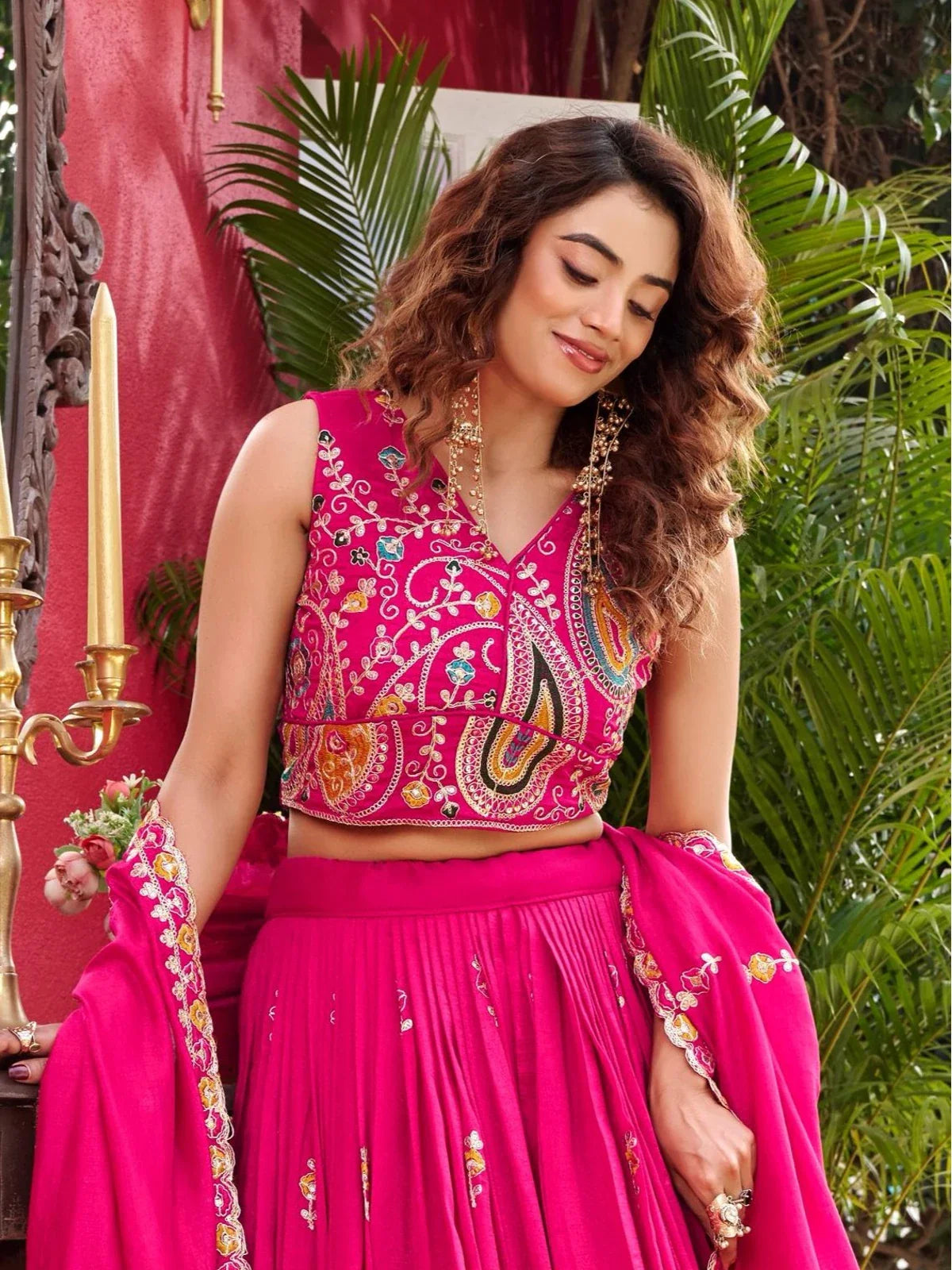 Tarani pink Vichitra lehenga upper body close-up showing embroidery and neckline design