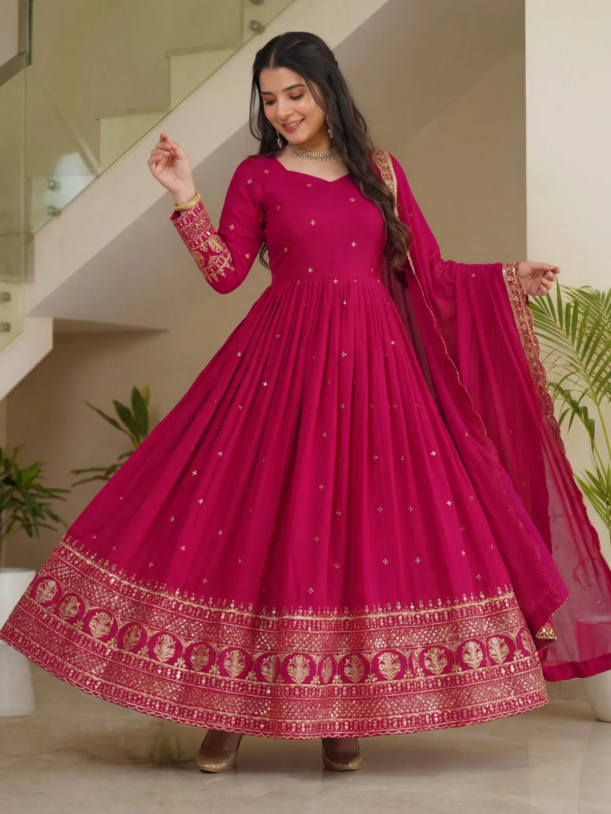 Tarani magenta gown in vichitra silk twirl look with zari embroidery and full flare