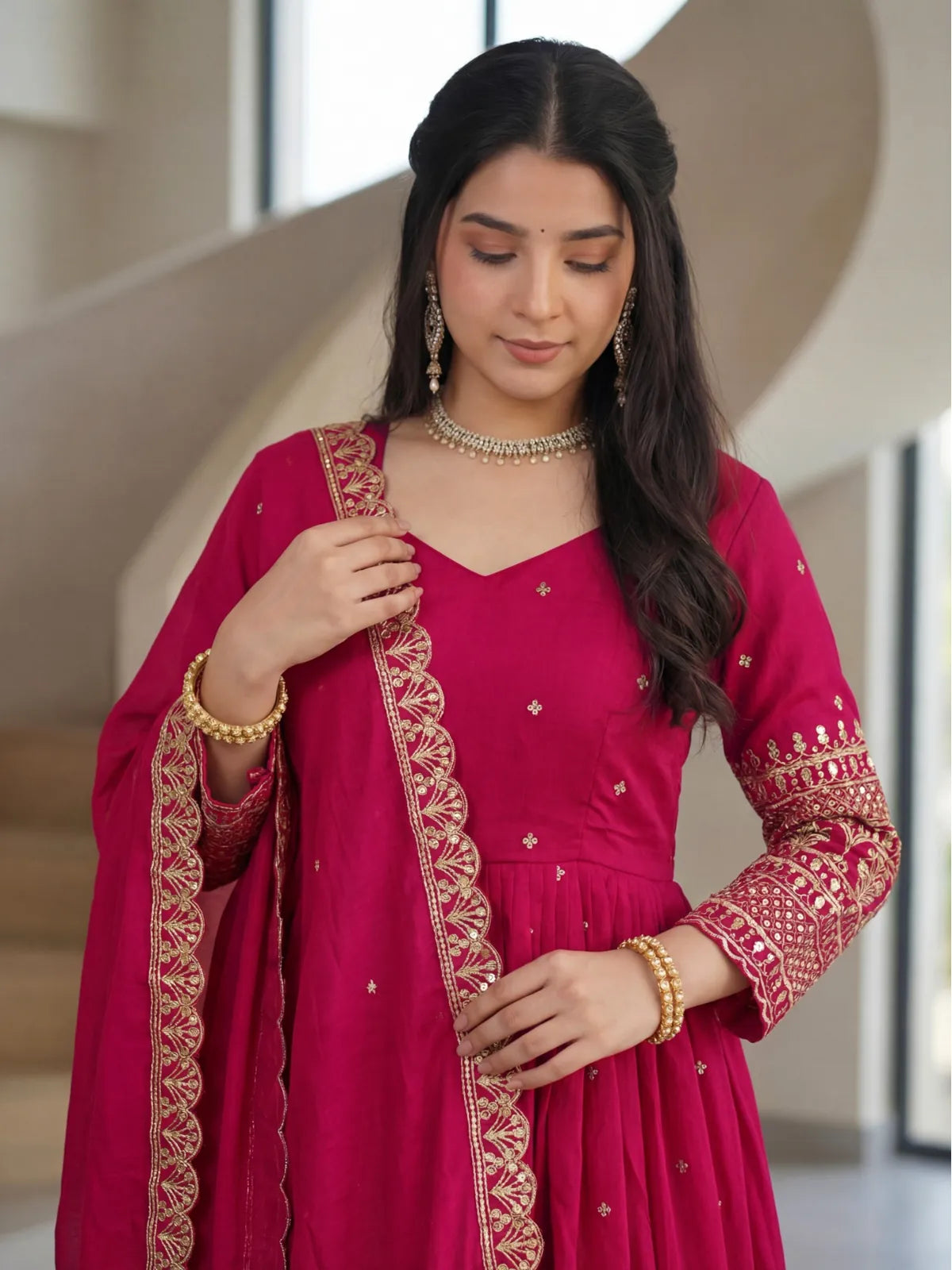 Tarani vichitra silk magenta gown with embroidered sleeve and dupatta close-up view