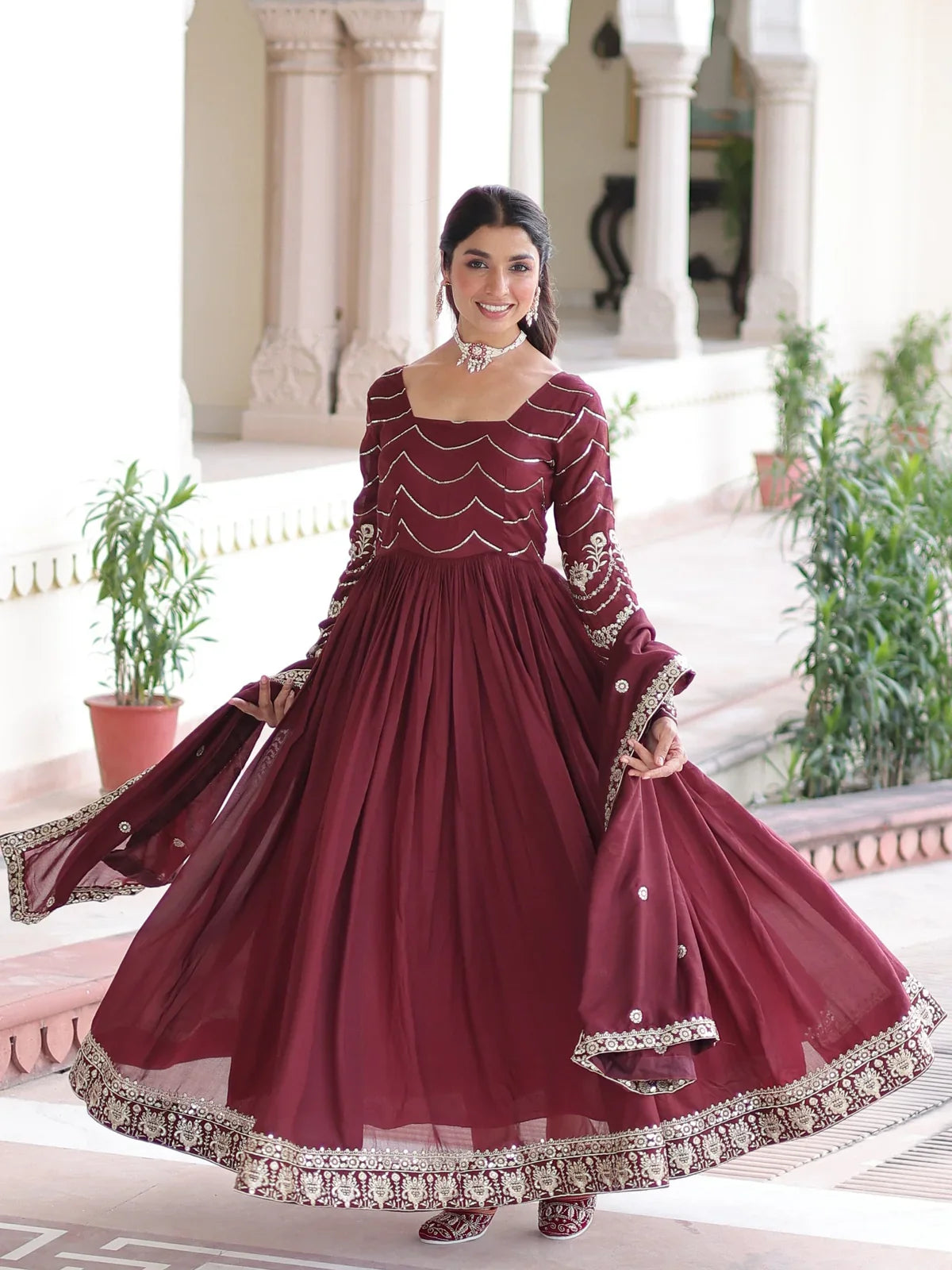 Tarani maroon Vichitra silk gown front view with flowing flair and elegant festive look