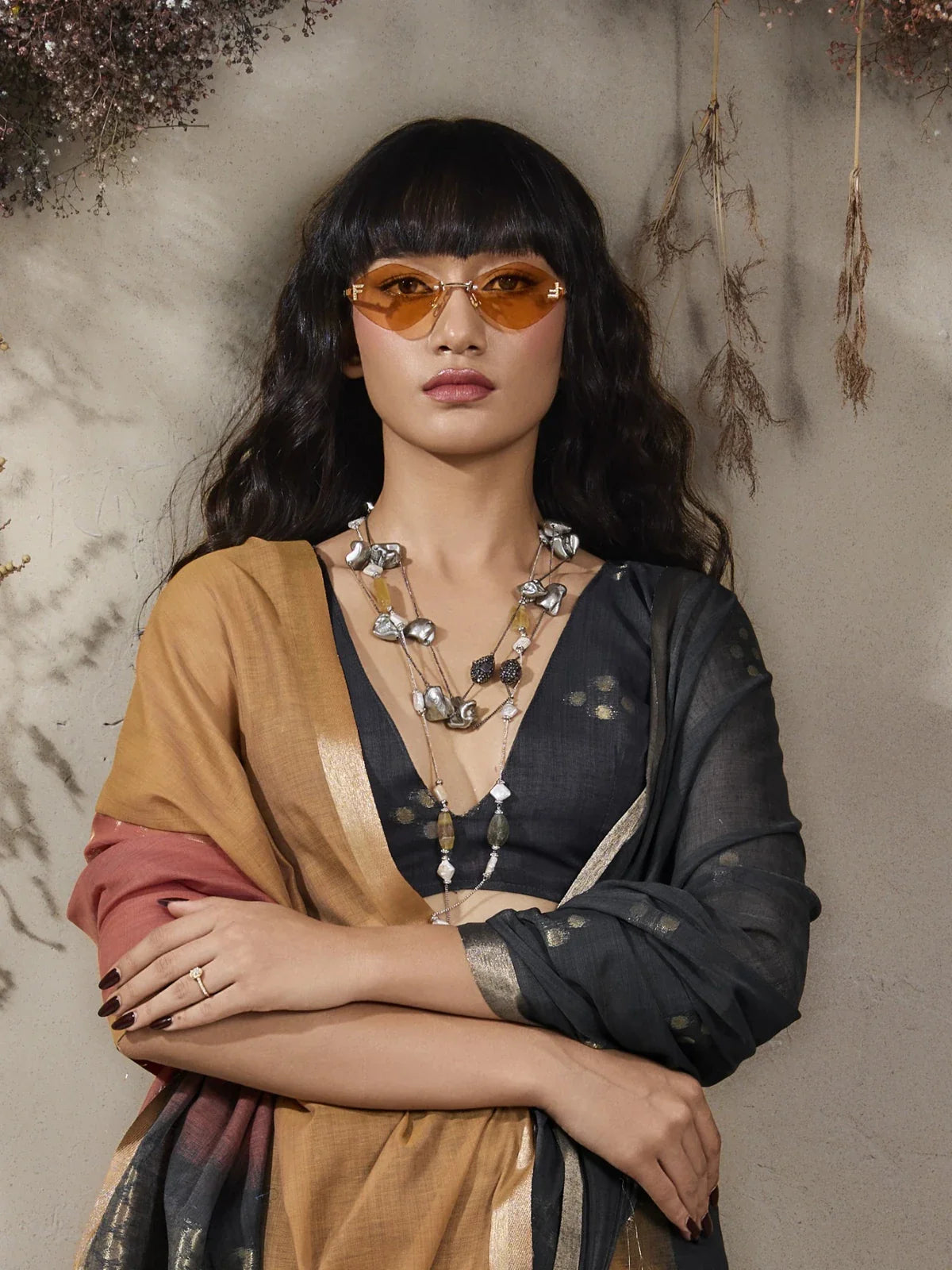 Tarani viscose cotton saree upper body closeup with statement necklace and soft woven fabric