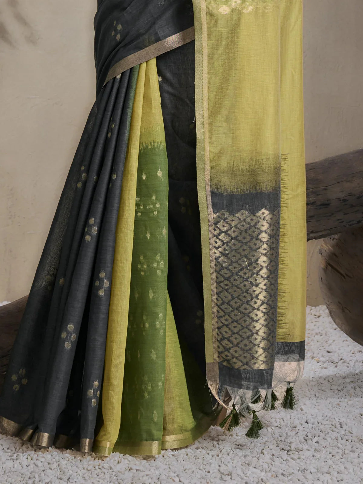 Tarani closeup view of green viscose cotton saree with intricate woven pallu and tassels