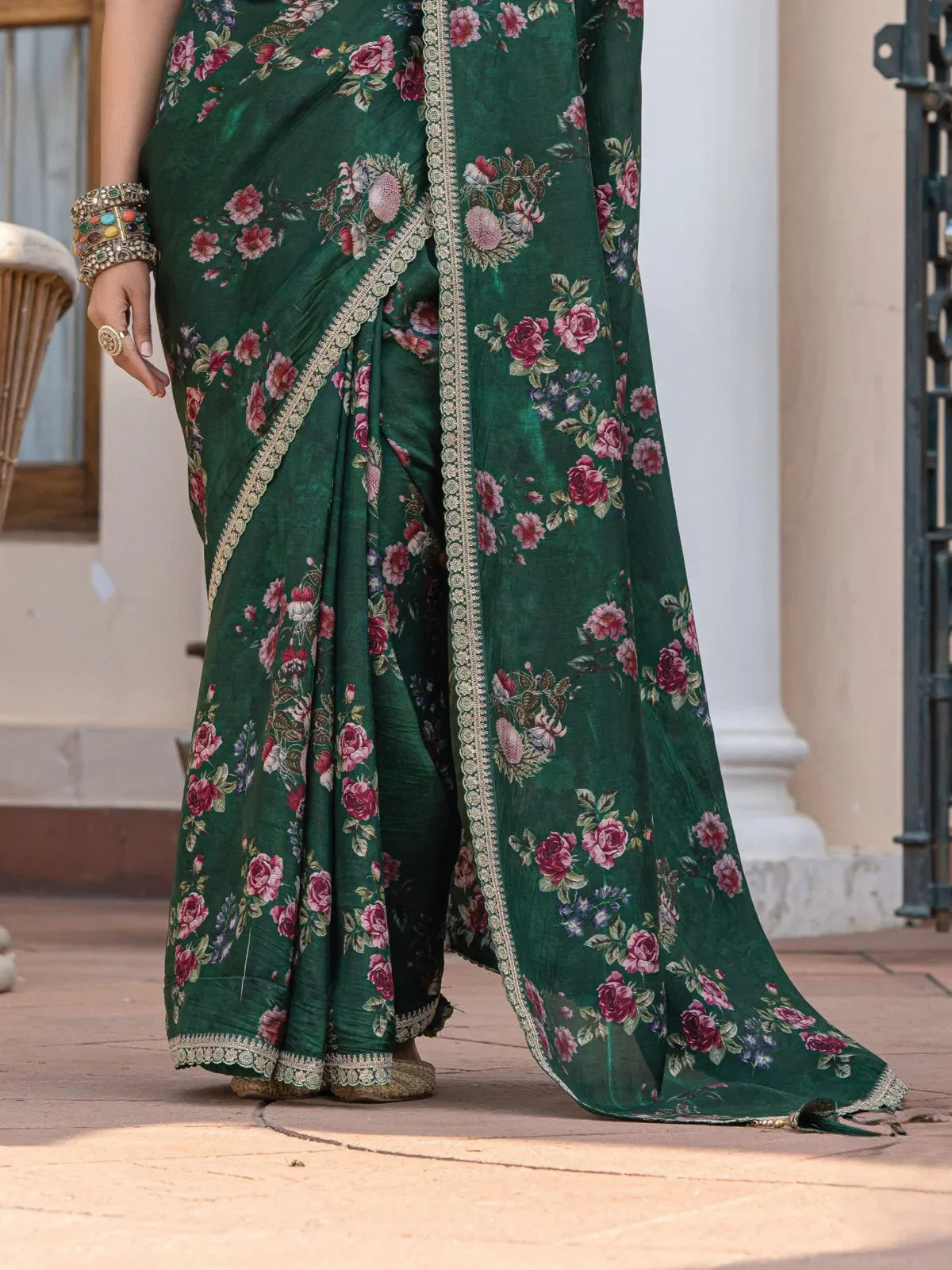 Tarani green viscose dola silk saree closeup view showing intricate floral patterns