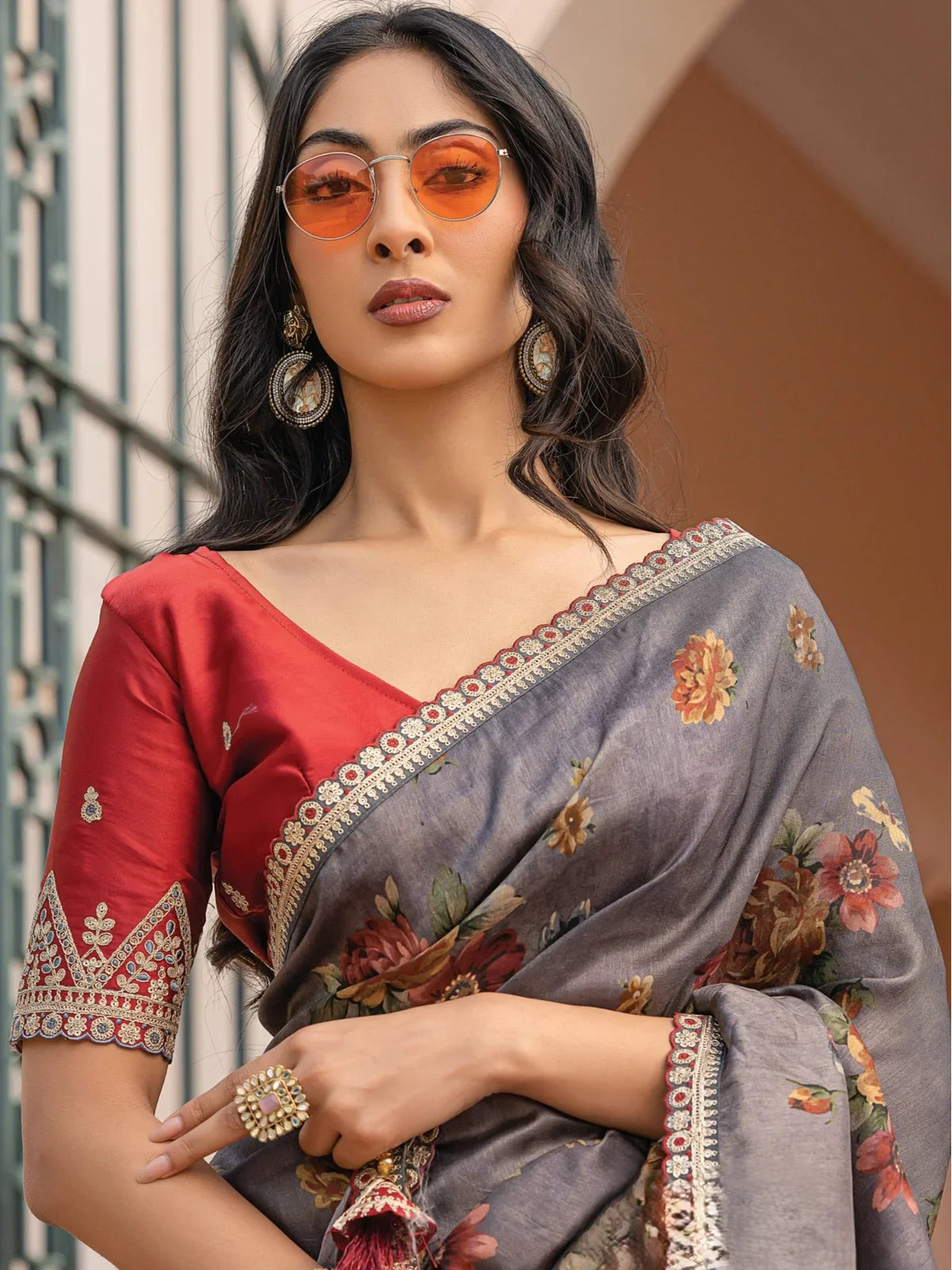 Tarani grey viscose dola silk saree upper body view showing floral prints and embroidered blouse