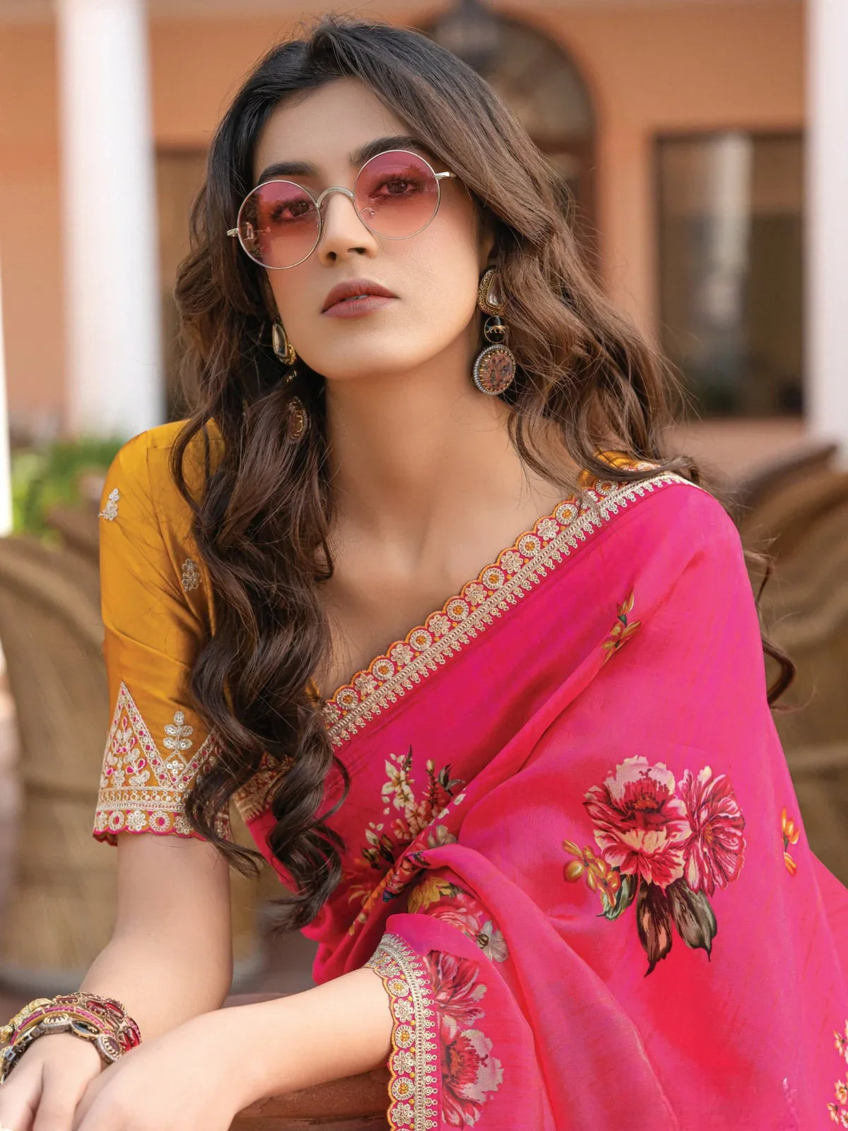 Tarani upper body view wearing pink floral viscose dola silk saree with mustard blouse and scalloped border