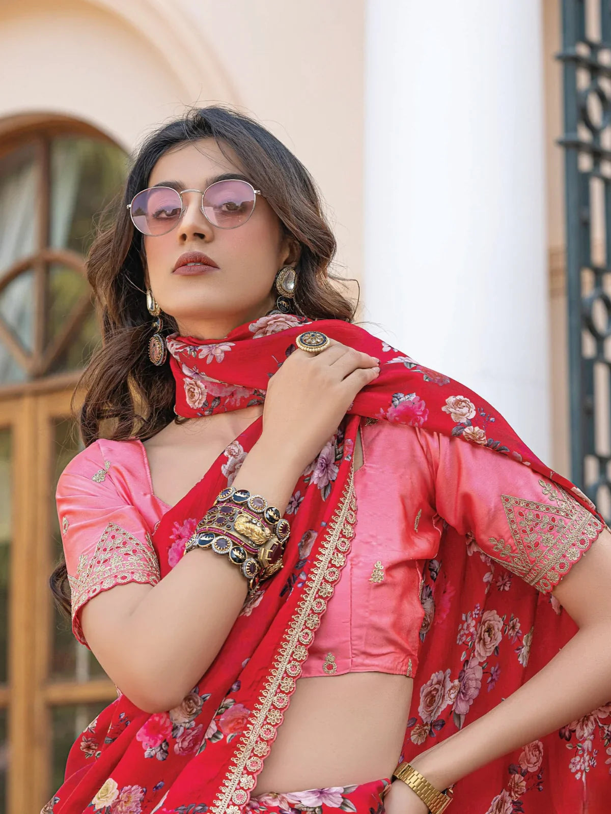 Tarani red viscose dola silk saree with floral motifs and blouse close up upper body view