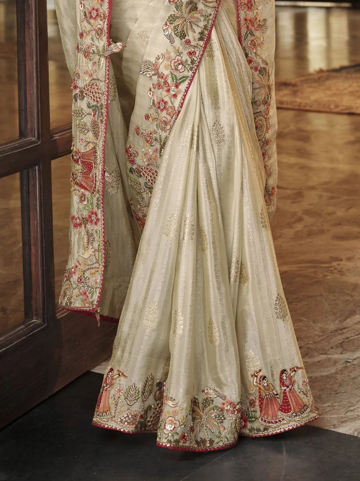 Tarani beige viscose jacquard saree pallu view showing tassels and intricate floral embroidery