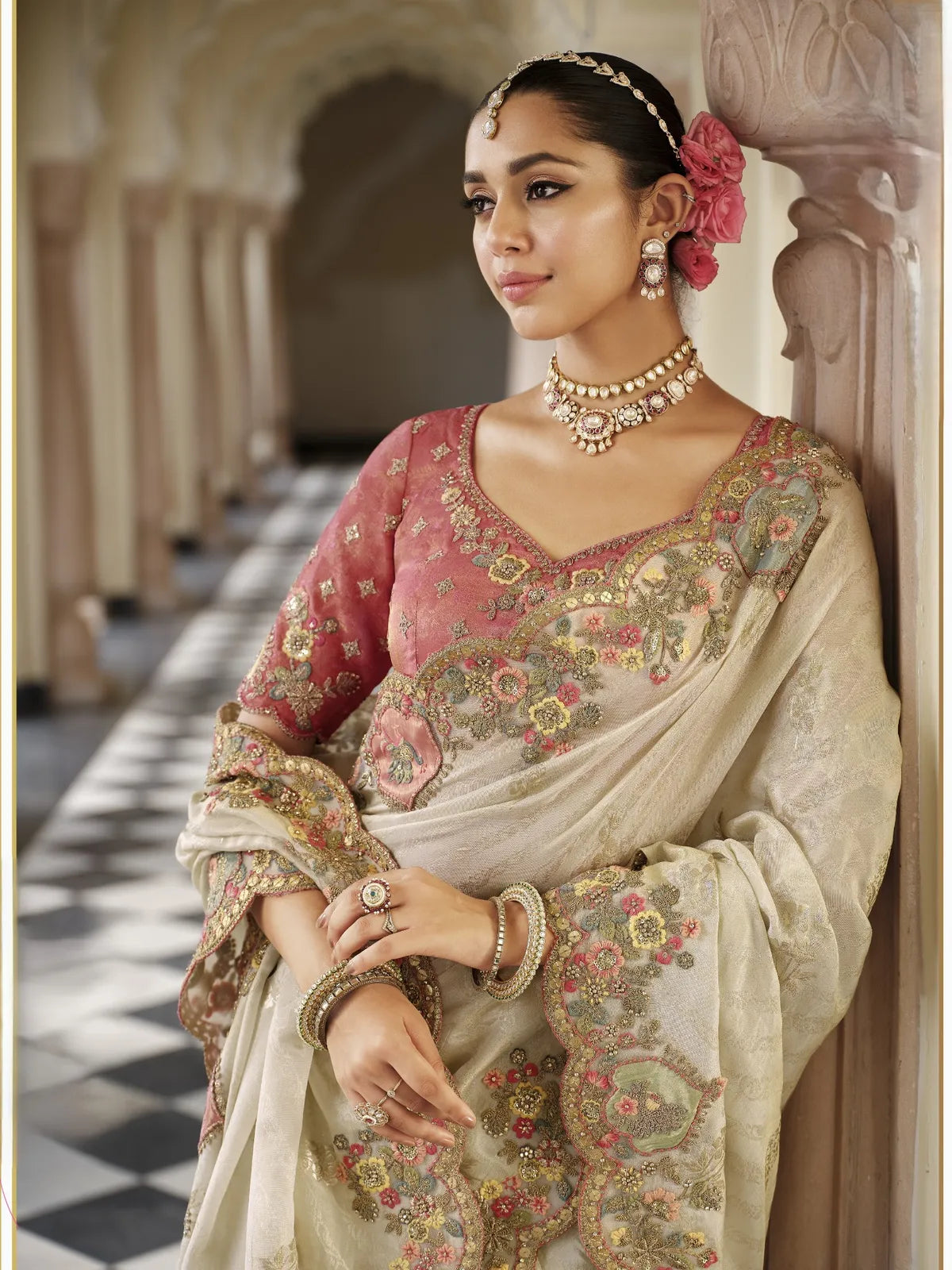 Tarani beige viscose jacquard saree upper body view with silk blouse and floral embroidery