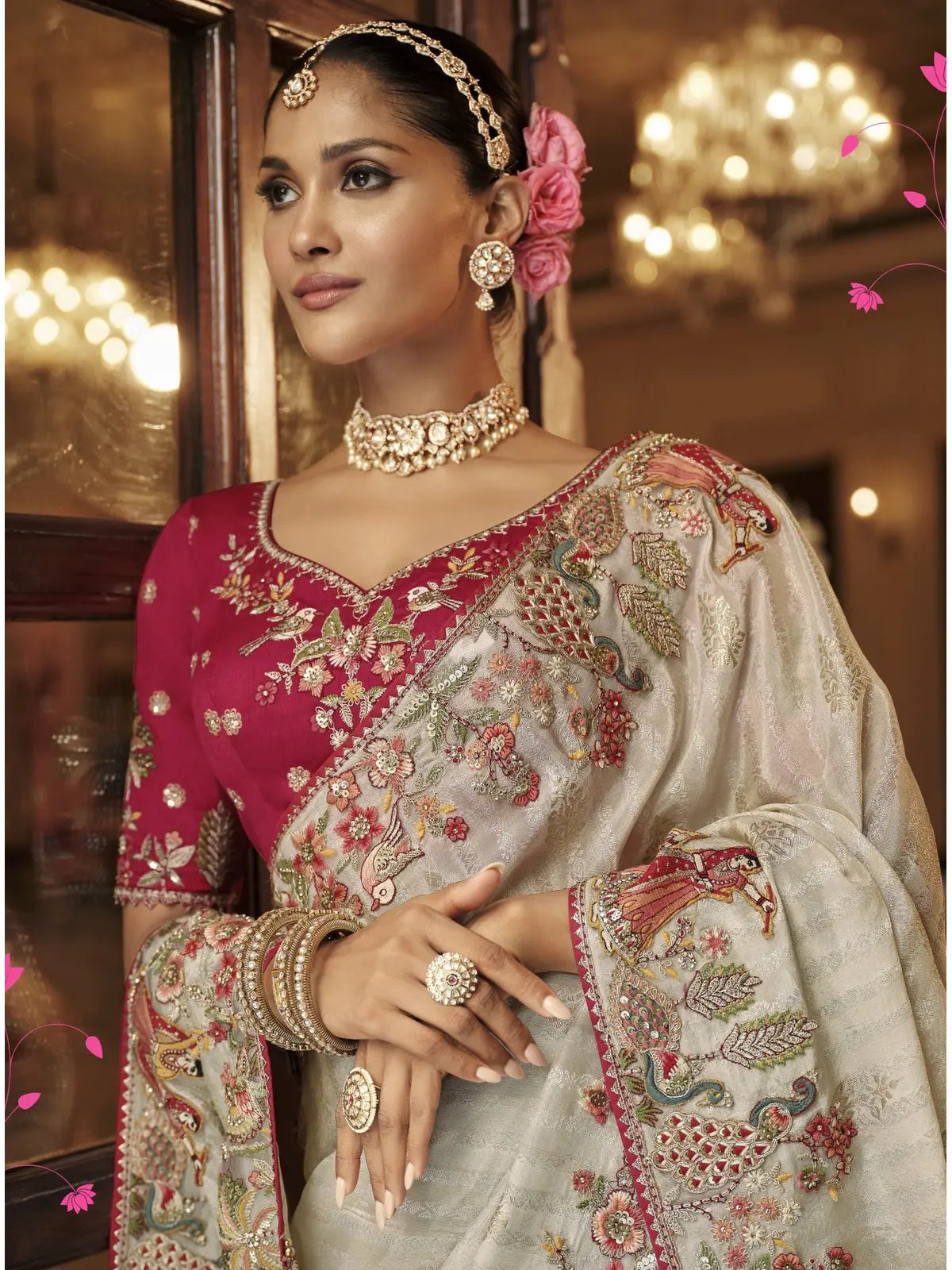 Tarani beige viscose jacquard saree upper body view with embroidered red blouse and jewelry