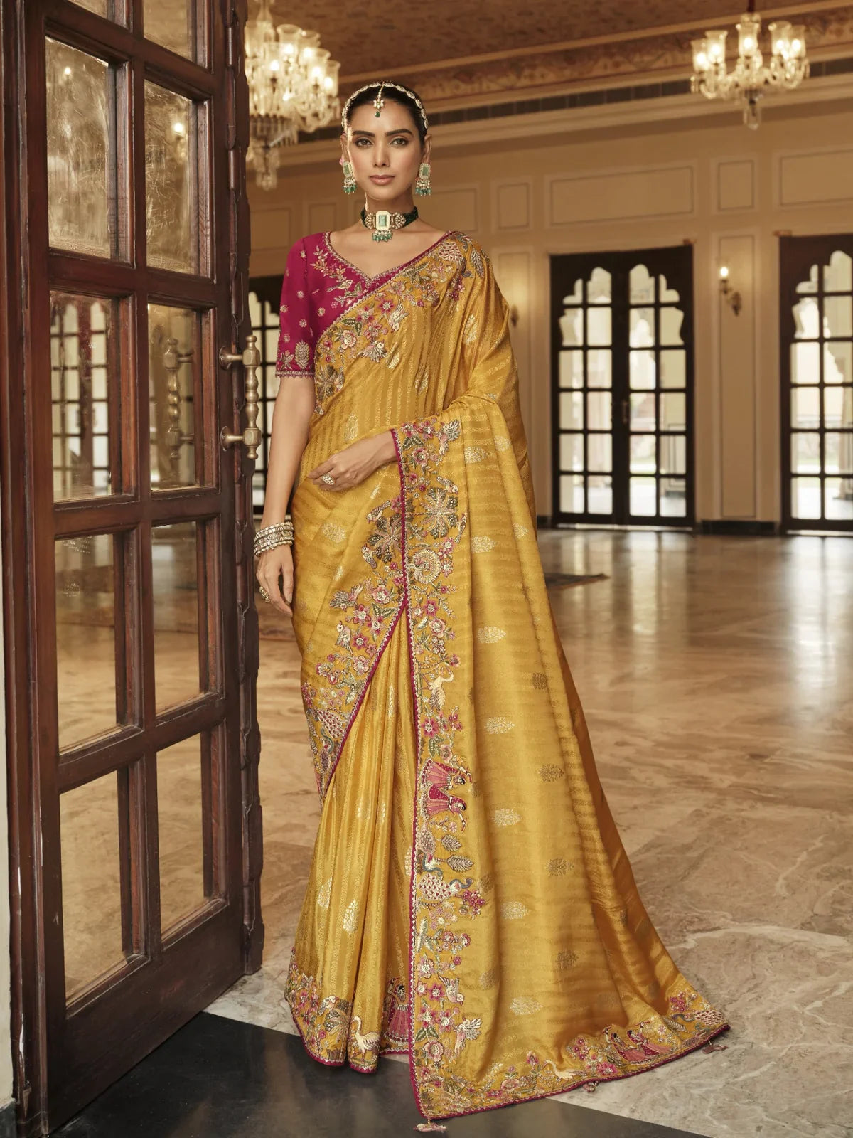 Tarani yellow viscose jacquard saree full view with embroidered silk blouse and tassel border