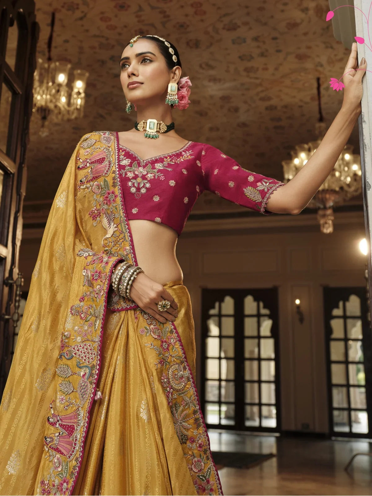 Tarani yellow viscose jacquard saree upper body closeup with silk blouse embroidery