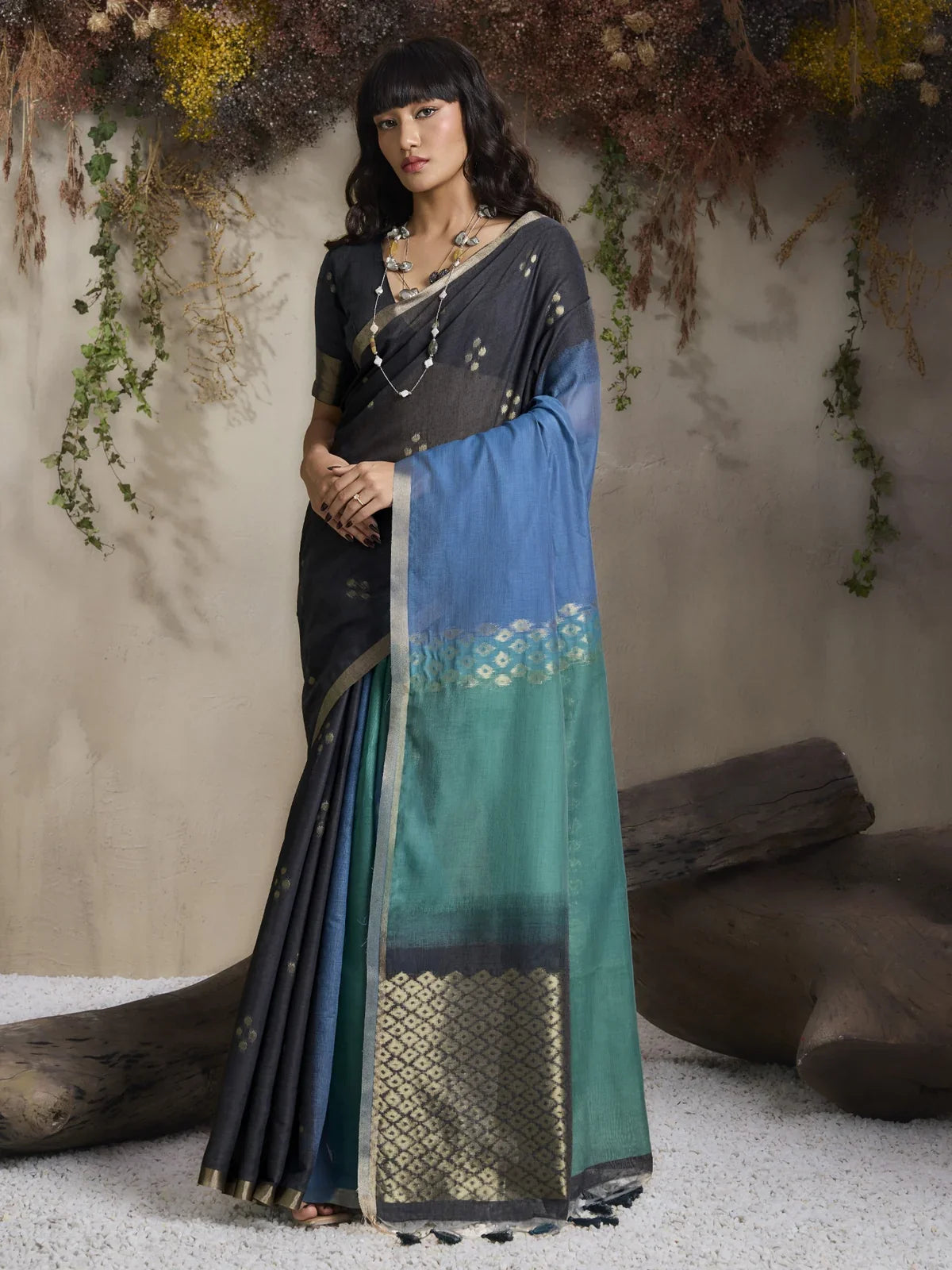 Tarani green viscose handloom party wear saree with dual tone weave and subtle gold motifs