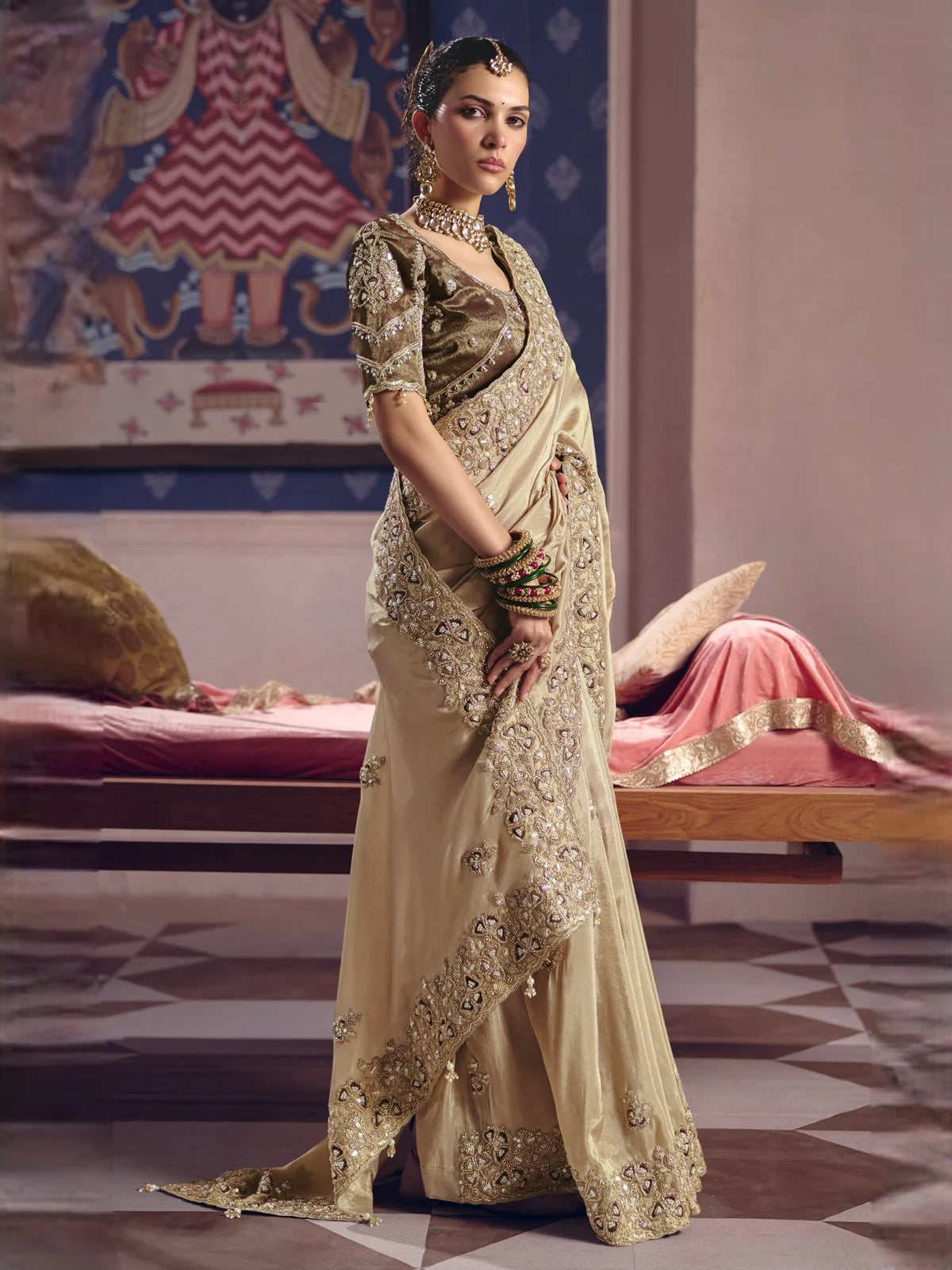 Tarani Pavitra beige party wear saree side view with heavy embroidery border and designer blouse