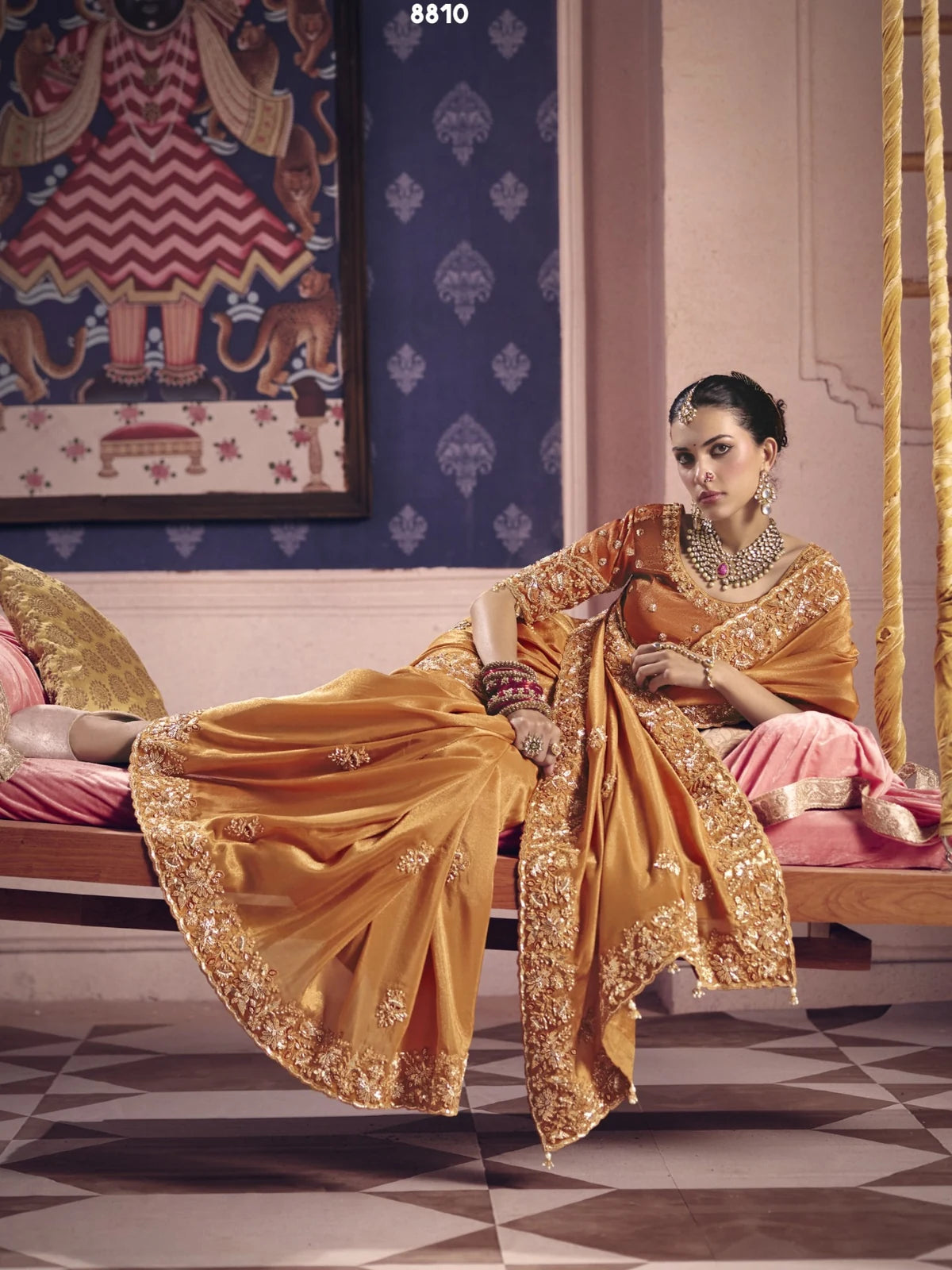 Tarani golden party wear embroidered saree front pose with zari border by Tarani Nimrita