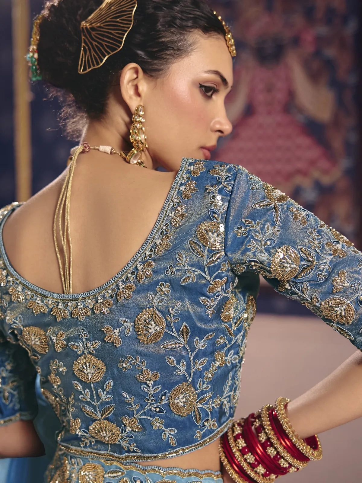 Tarani Harshada blouse back view in sky blue zari tissue silk with intricate embroidery and festive styling
