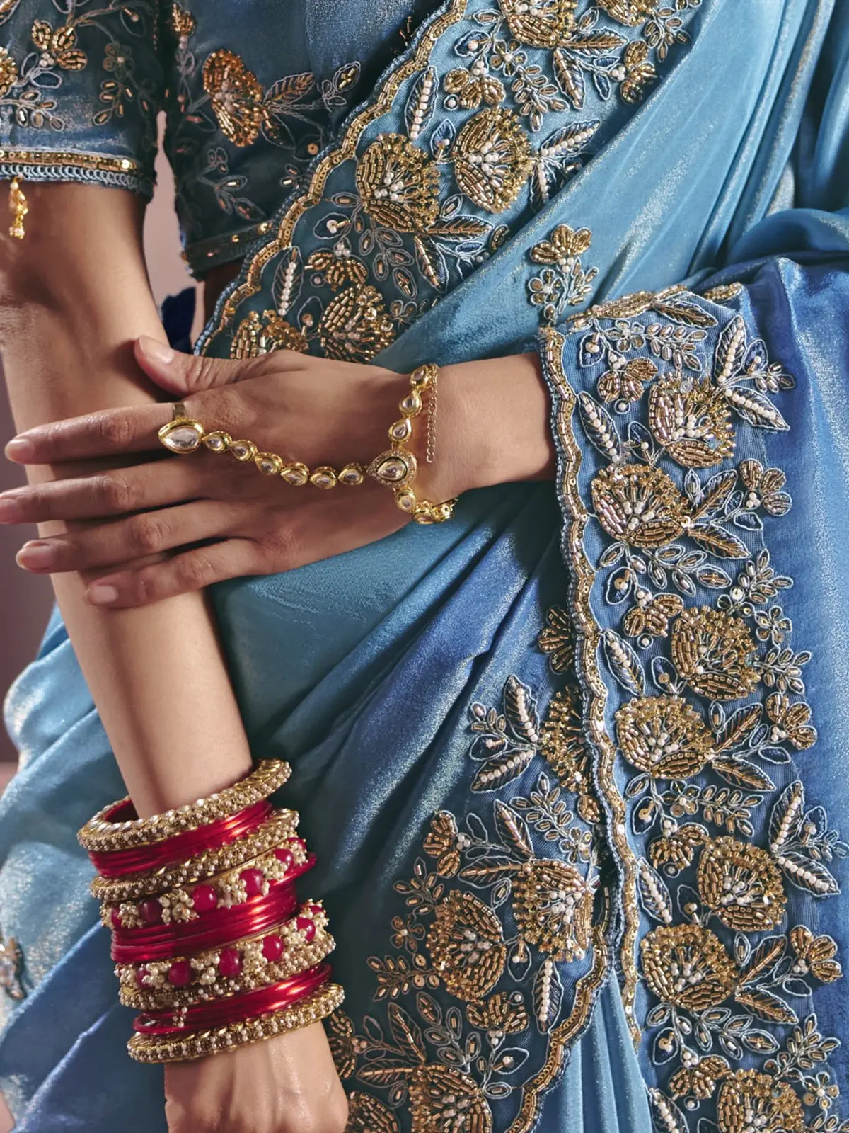 Tarani Harshada sky blue saree closeup showing embroidery bead work zari border and premium detailing