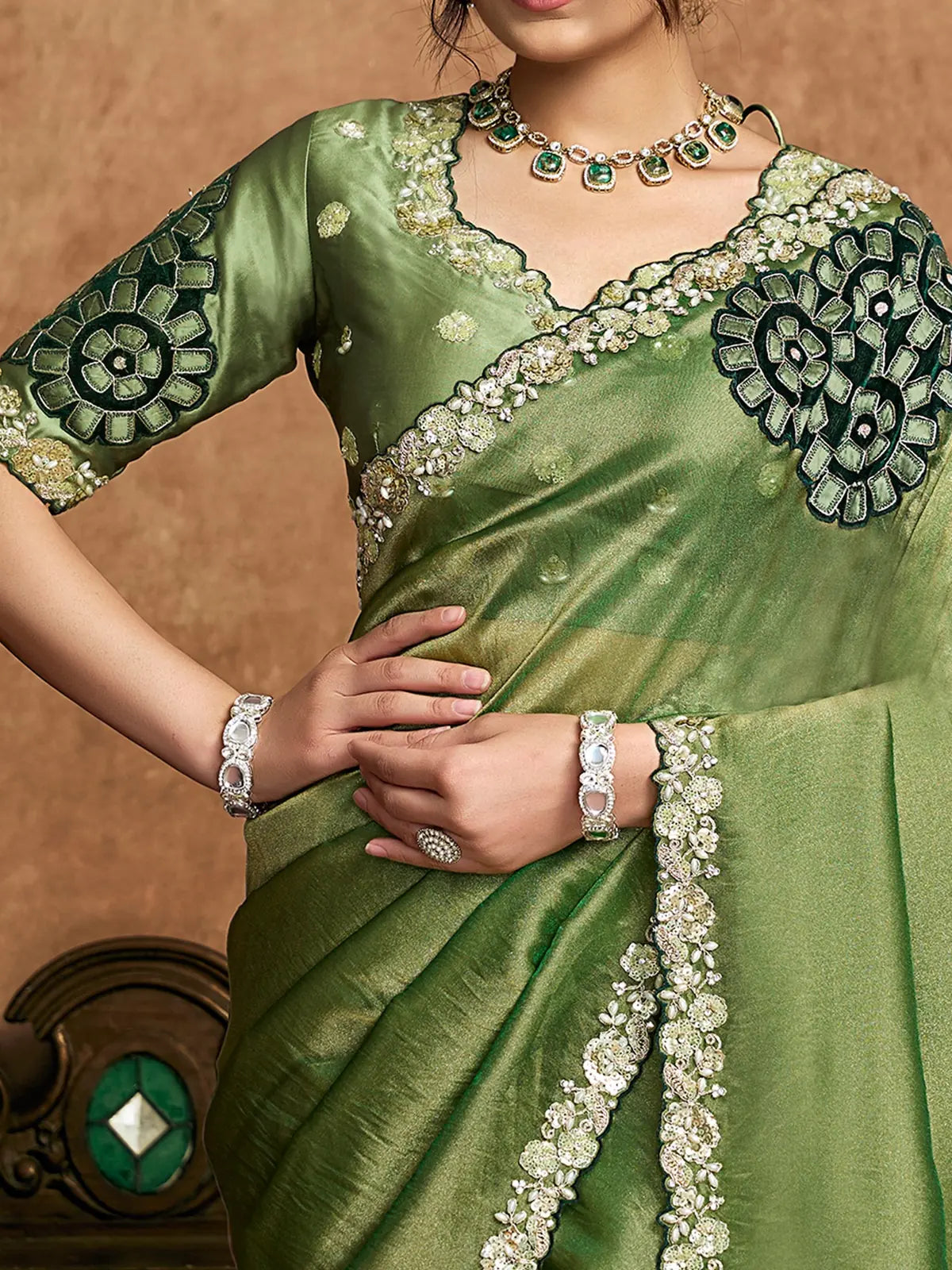 Tarani Rajashri green Zari Organza Satin saree closeup showcasing pearl stone sequin border details